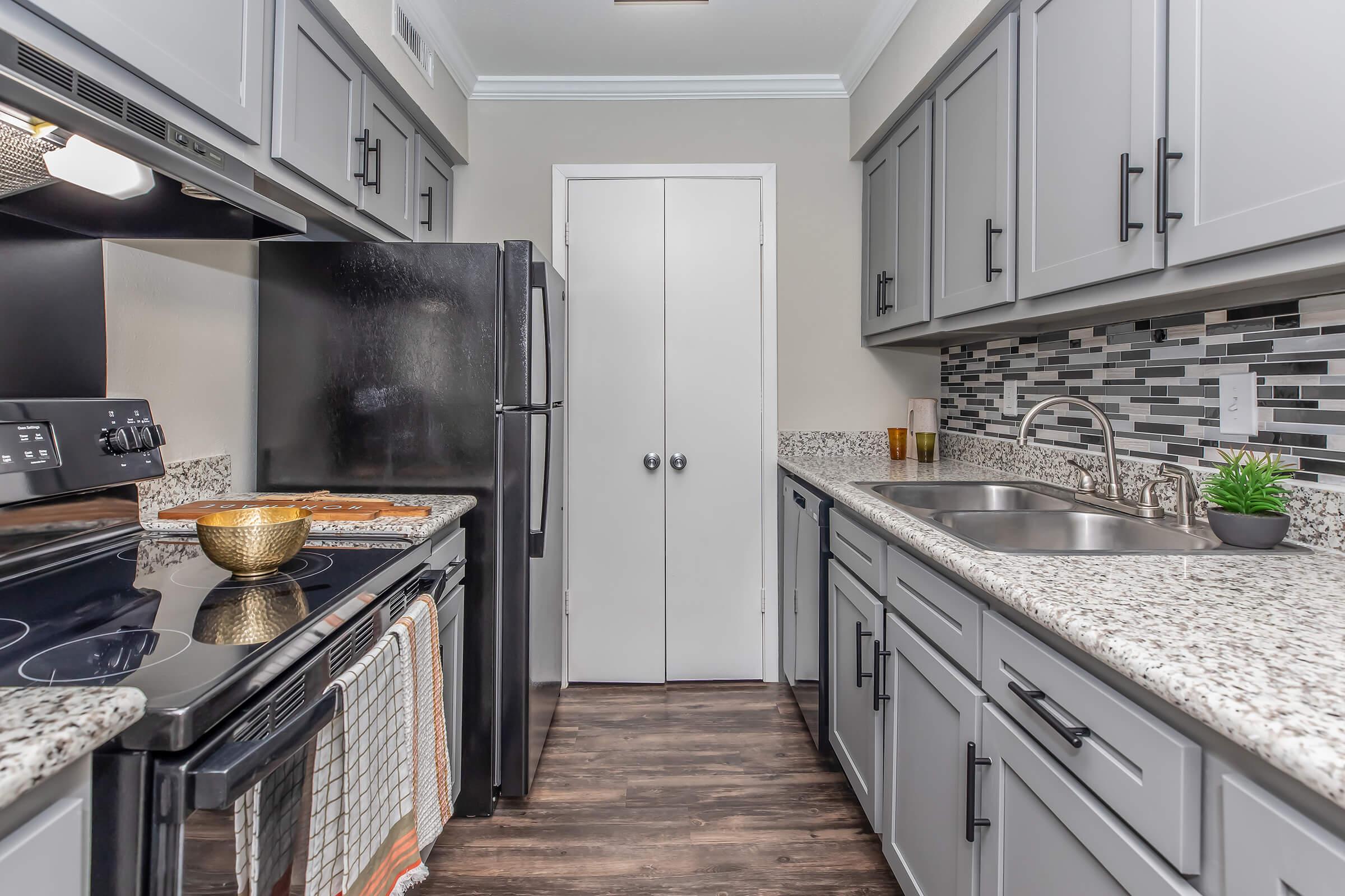 a large kitchen with stainless steel appliances