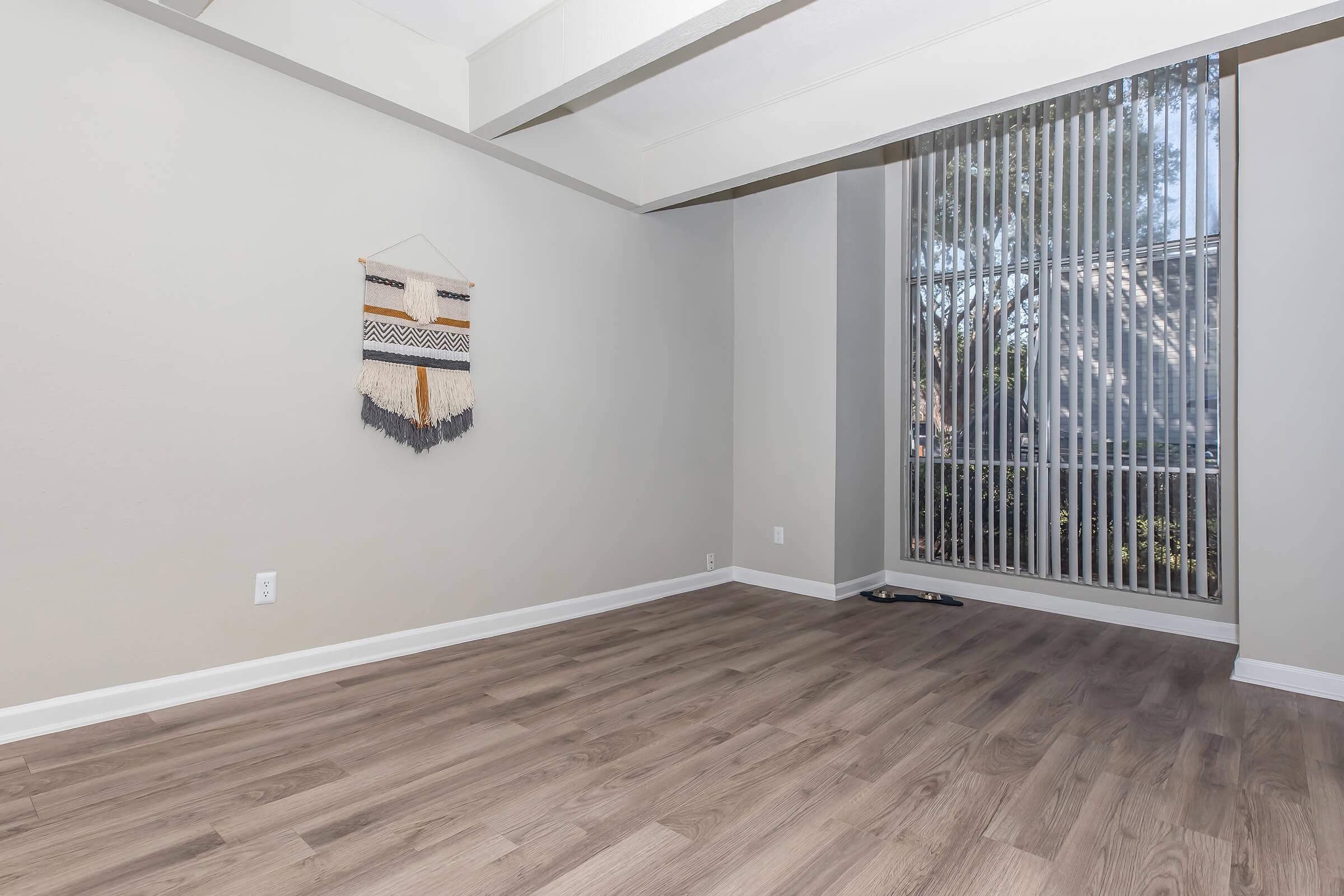 a bedroom with a large window