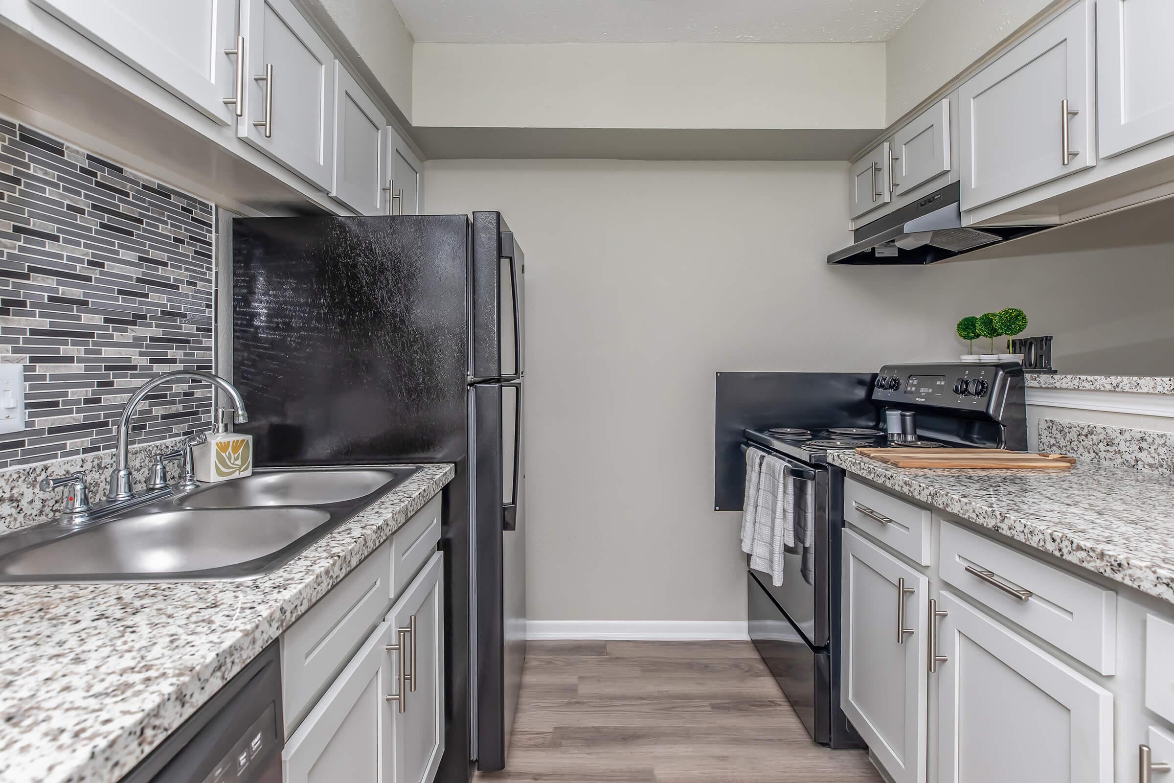 a modern kitchen with stainless steel appliances