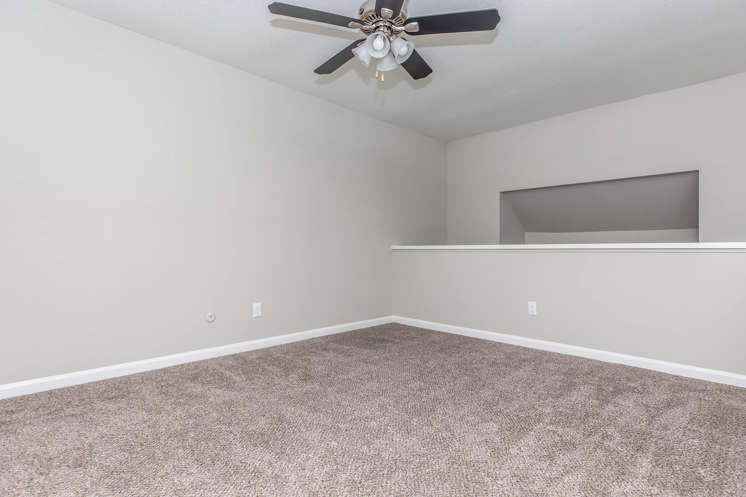 a bedroom with a large mirror