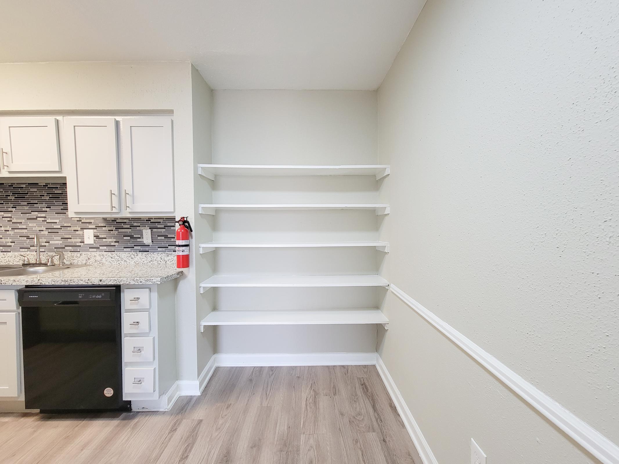 a refrigerator freezer sitting inside of a building