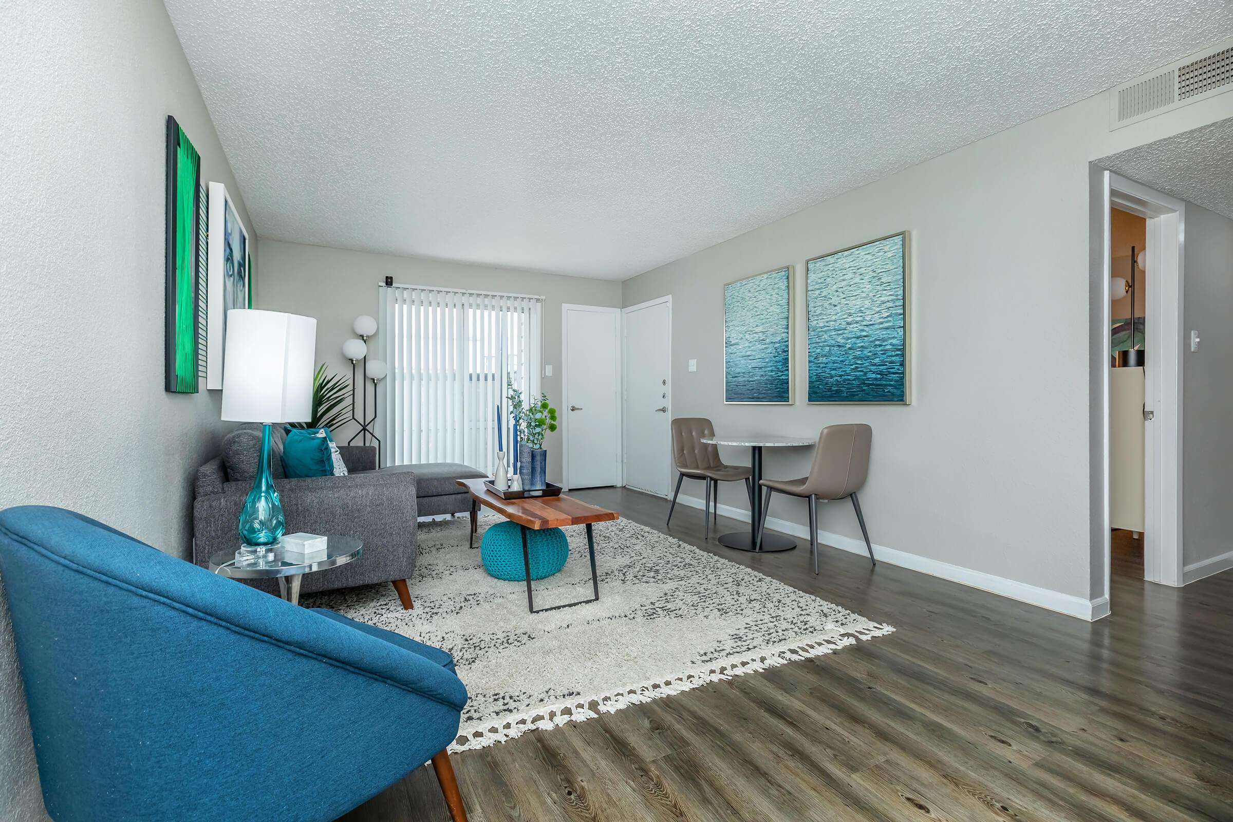 a living room filled with furniture and a rug