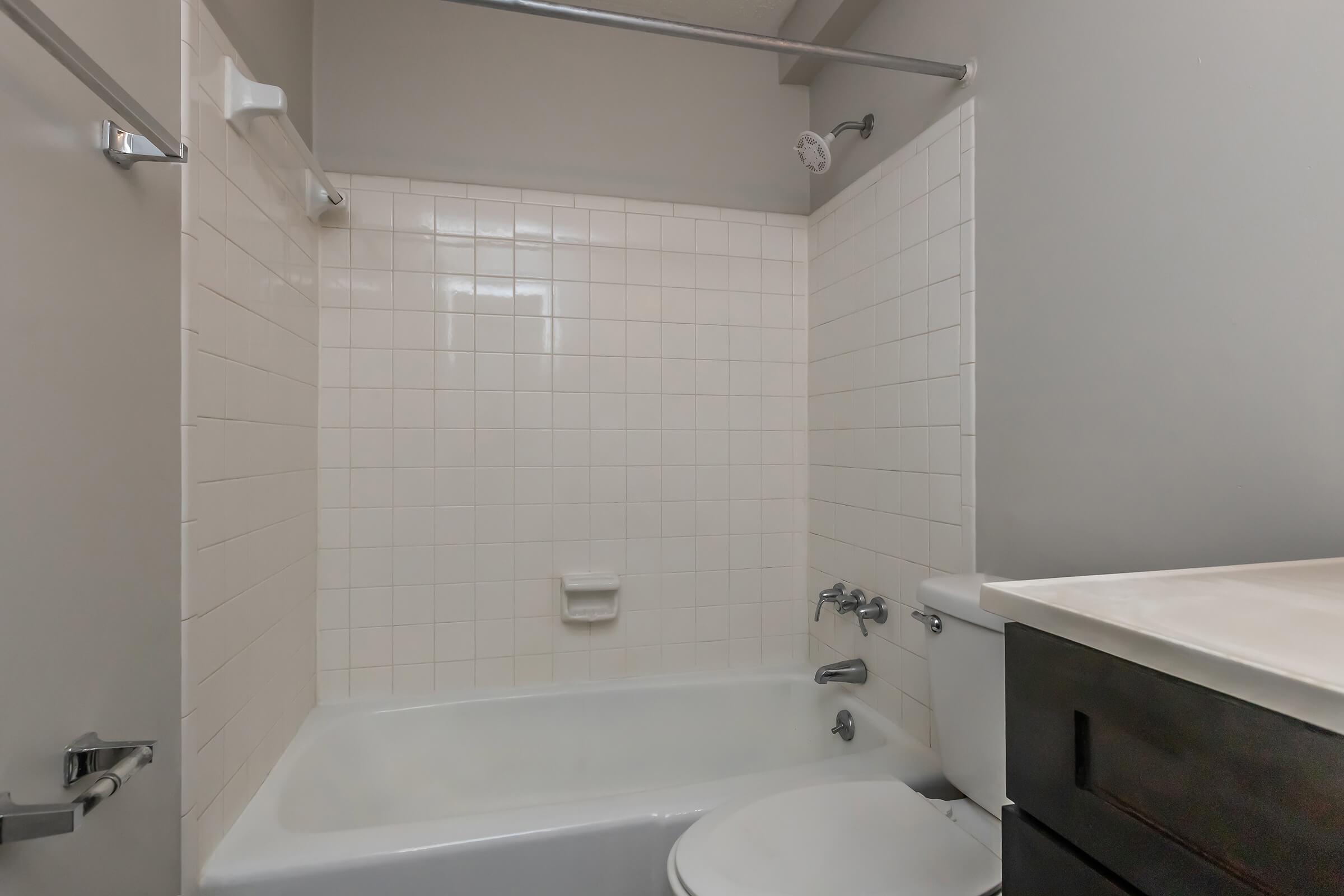 a room with a sink and a bath tub