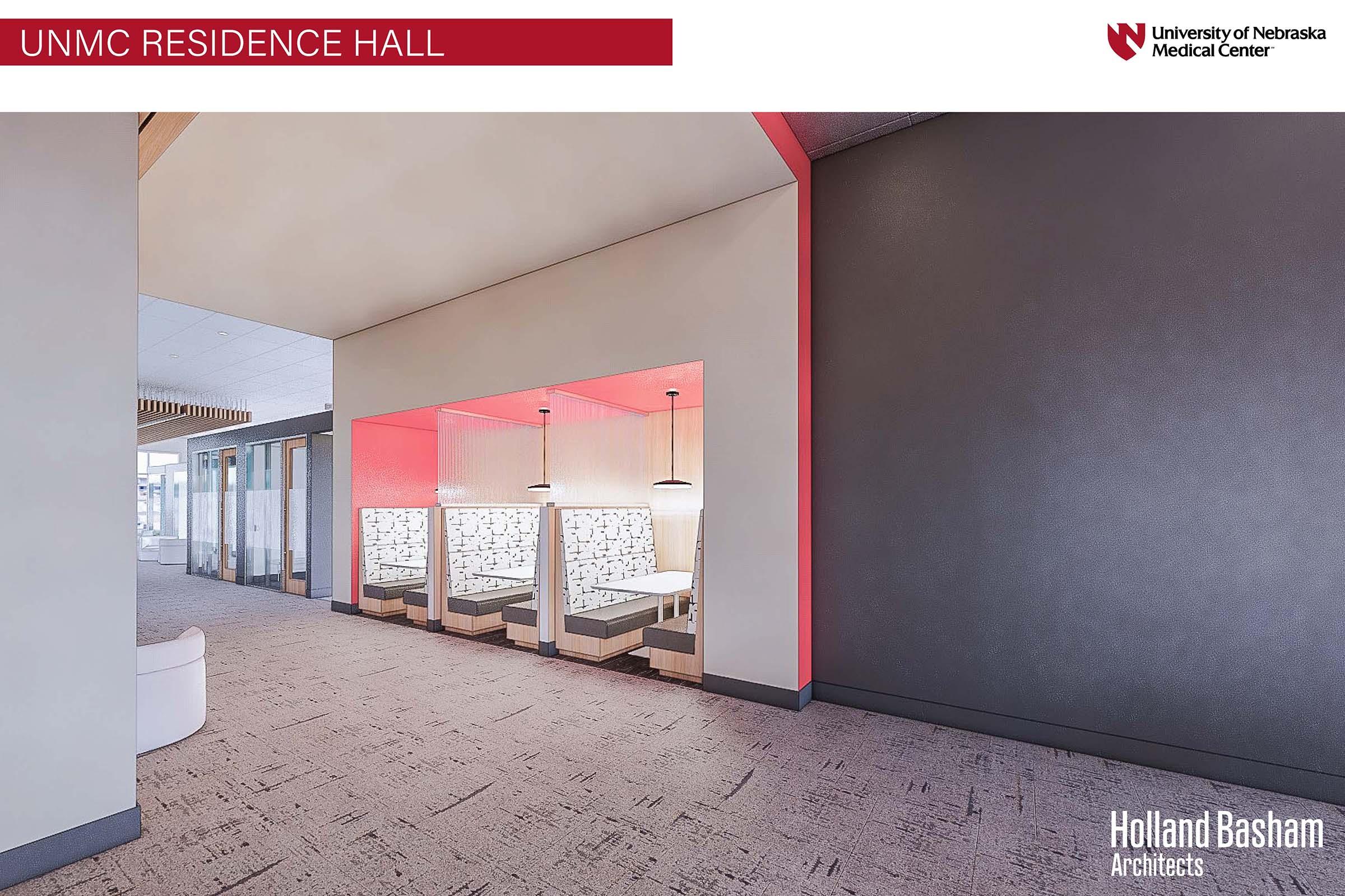 Interior view of a modern residence hall at UNMC, featuring a spacious hallway with a light color scheme. There are comfortable seating areas with privacy partitions, and large windows for natural light. The design is contemporary, highlighting functionality and a welcoming atmosphere for residents.