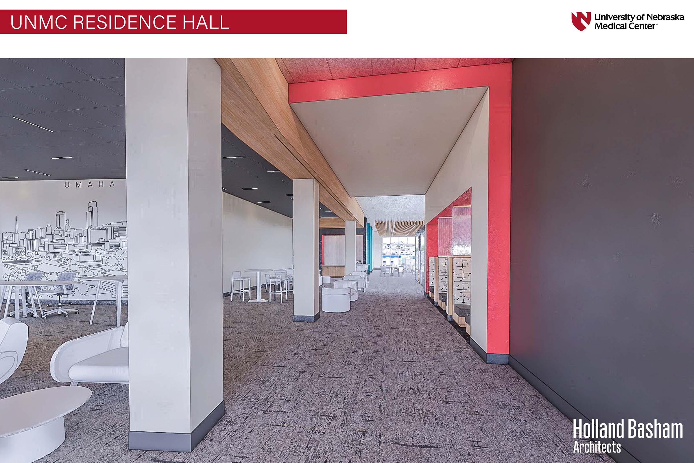 Interior view of the UNMC Residence Hall featuring a modern, spacious corridor with a minimalist design. There are white chairs and tables along the sides, light wooden beams on the ceiling, and vibrant red and gray wall accents. The space is well-lit, promoting a welcoming atmosphere for residents.