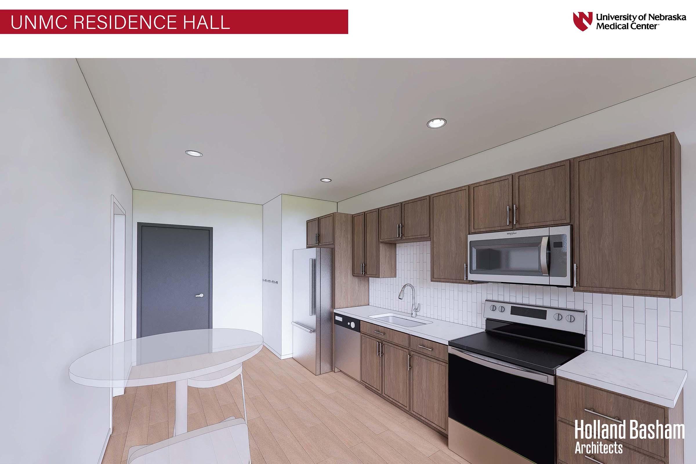 Interior view of a modern kitchen in a residence hall at the University of Nebraska Medical Center. Features include wooden cabinetry, a stainless steel refrigerator, microwave, and stove, along with a white sink and a round dining table. The flooring is light-colored wood.