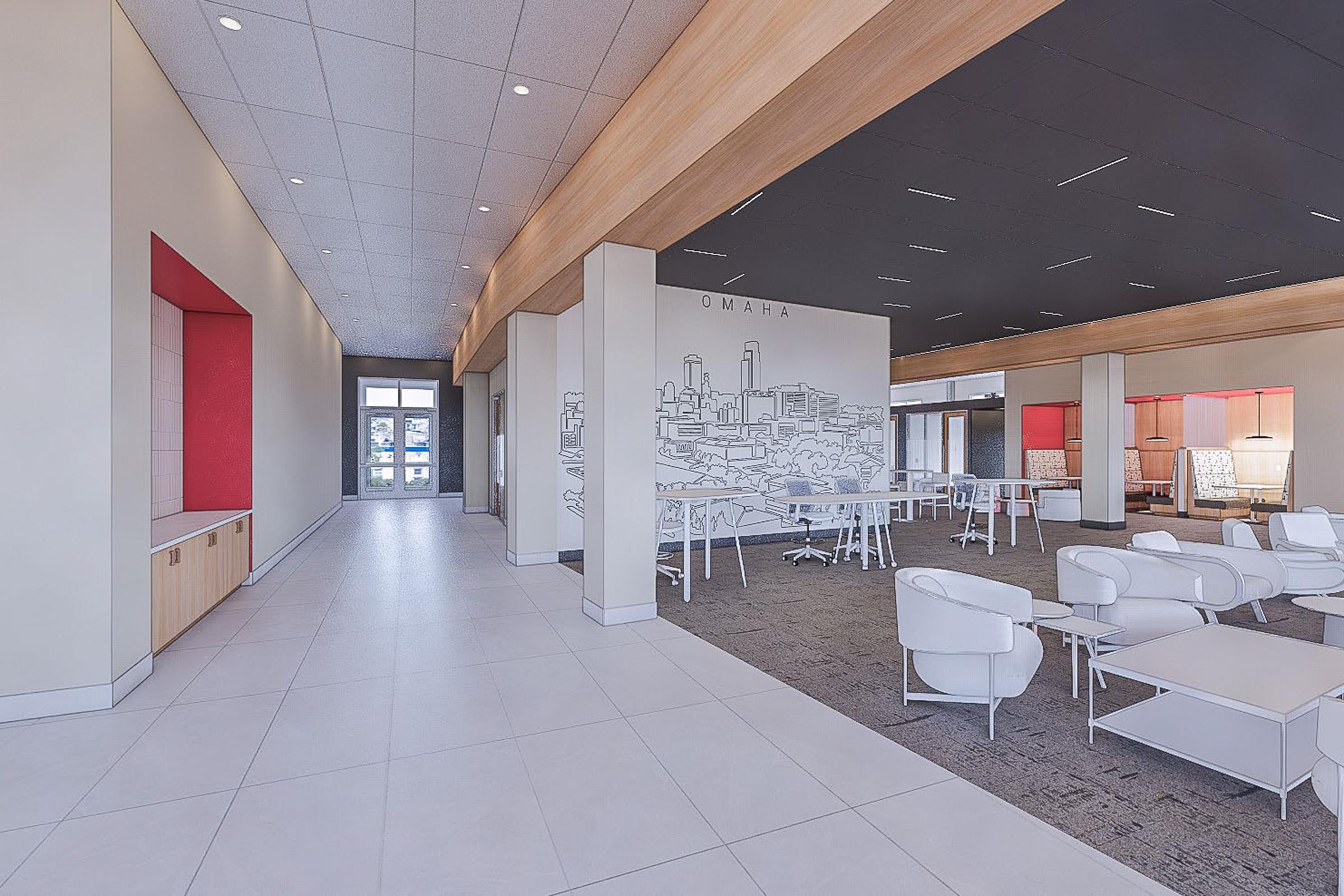 Modern interior hallway of a spacious venue featuring sleek furniture, stylish seating areas, and a large mural of Omaha. The design includes light-colored walls, wooden accents, and red highlights. Natural light floods the space through large windows at the entrance, creating a welcoming atmosphere.