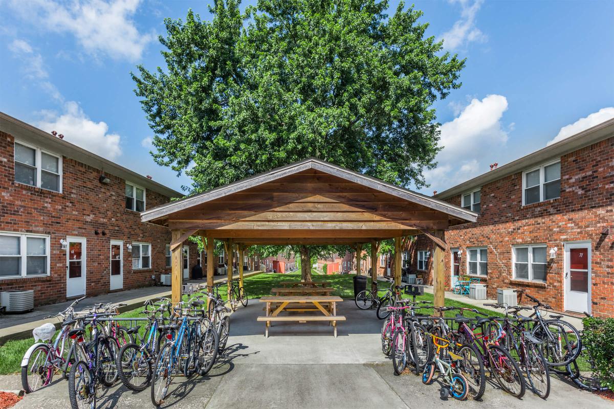 a bicycle parked in front of a brick building