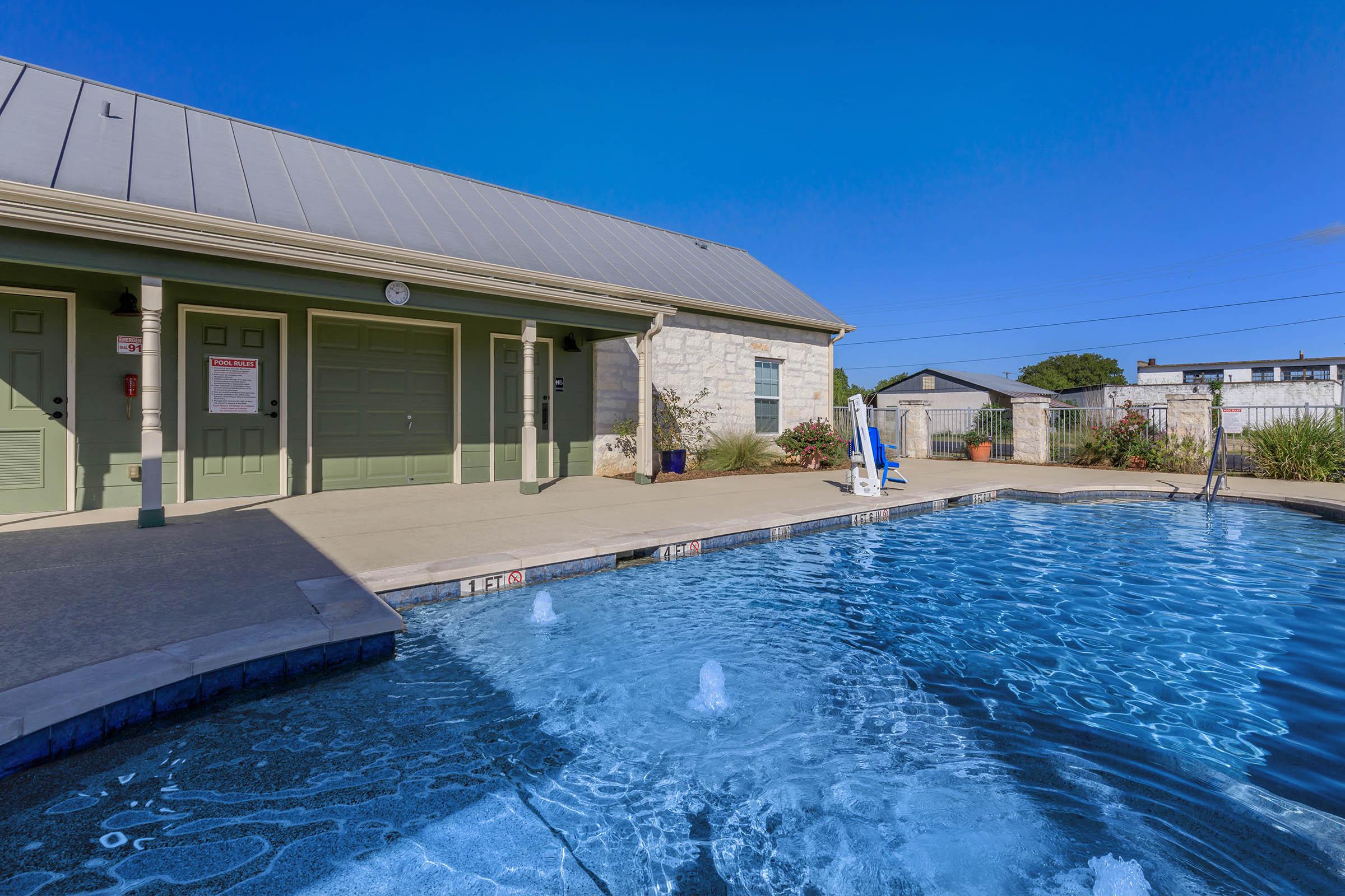 a house with a large pool of water