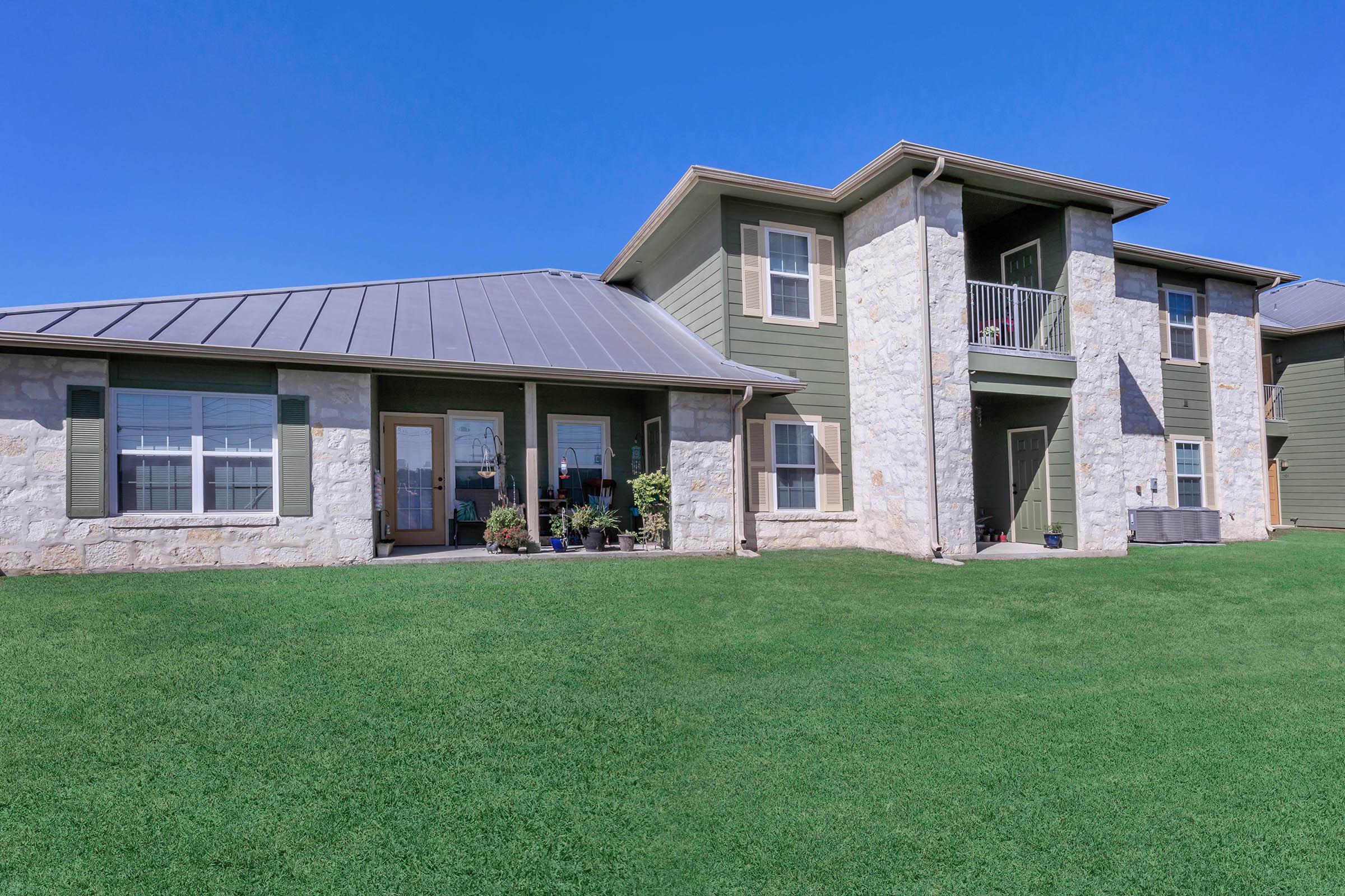 a house with a green field