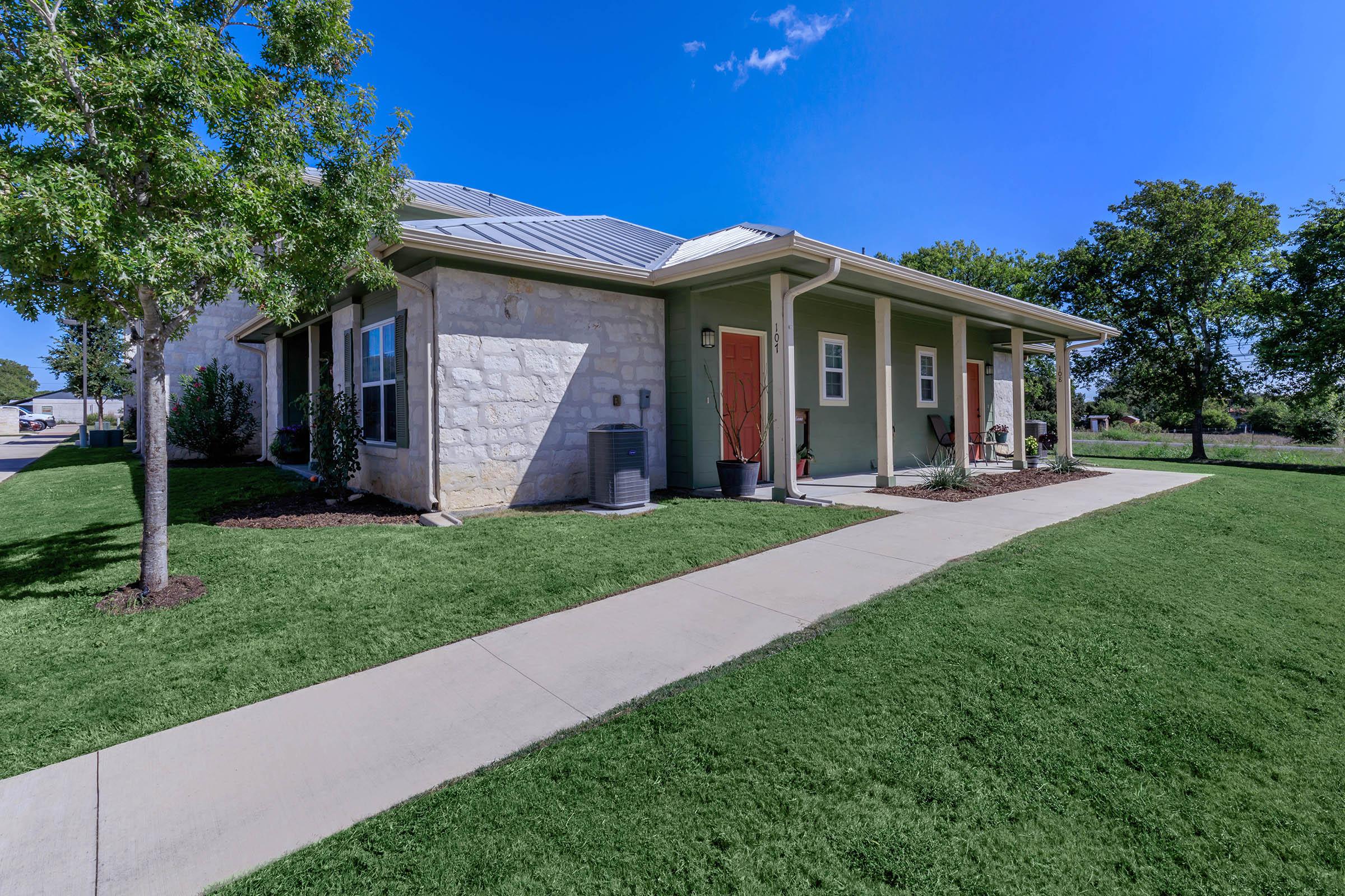 a large lawn in front of a house