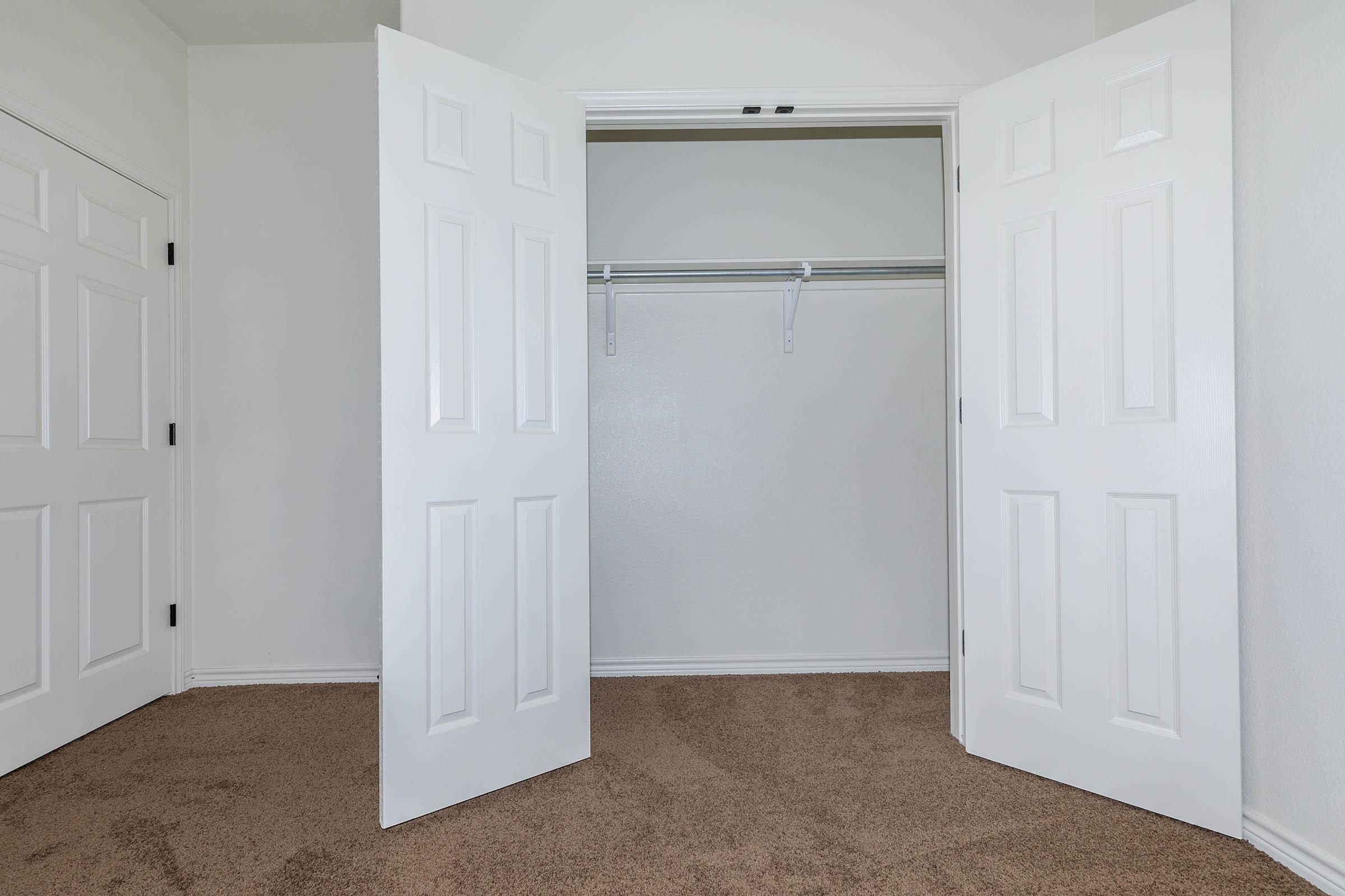 a white refrigerator freezer sitting next to a door