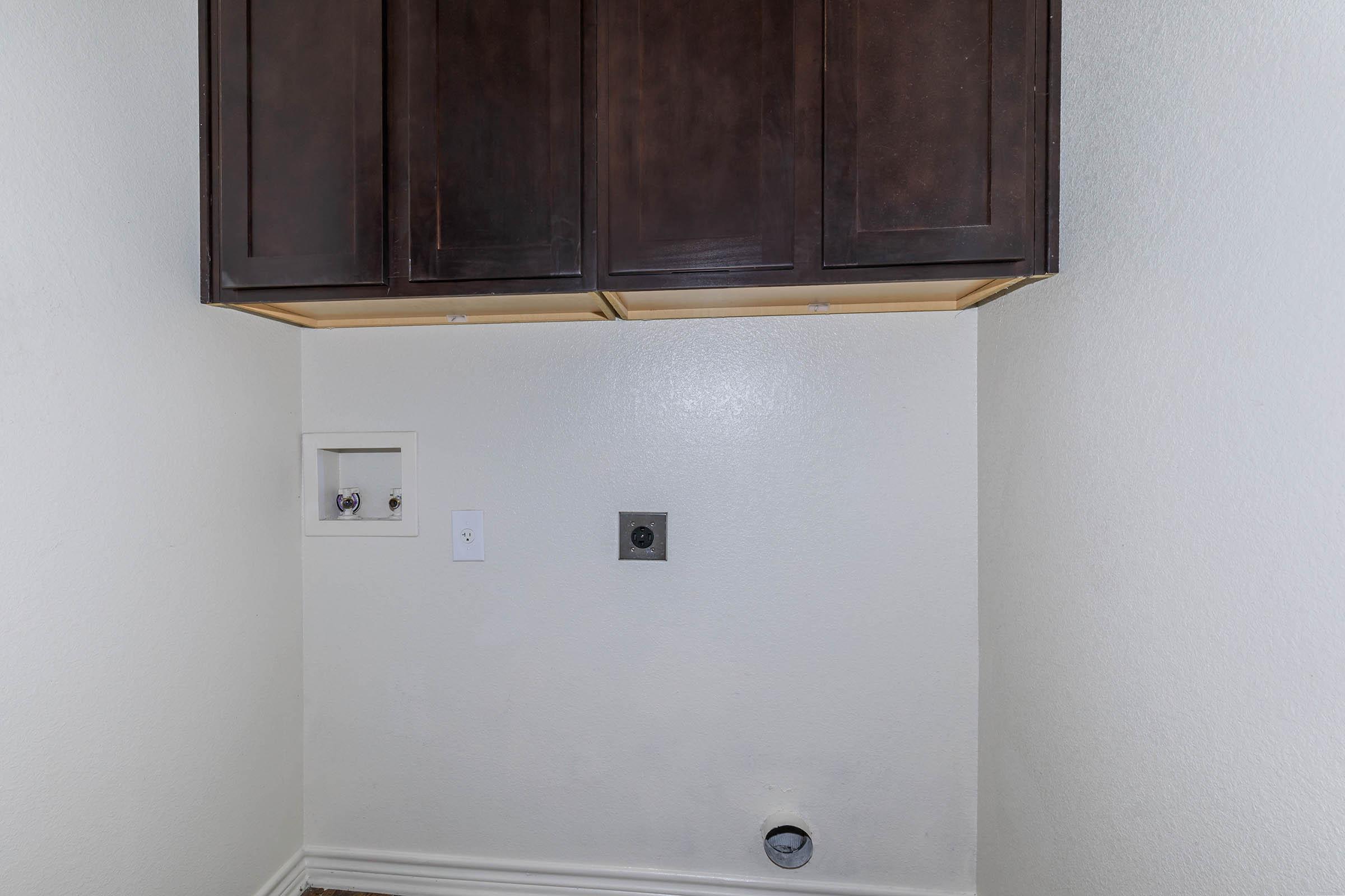 a white refrigerator freezer sitting inside of a kitchen