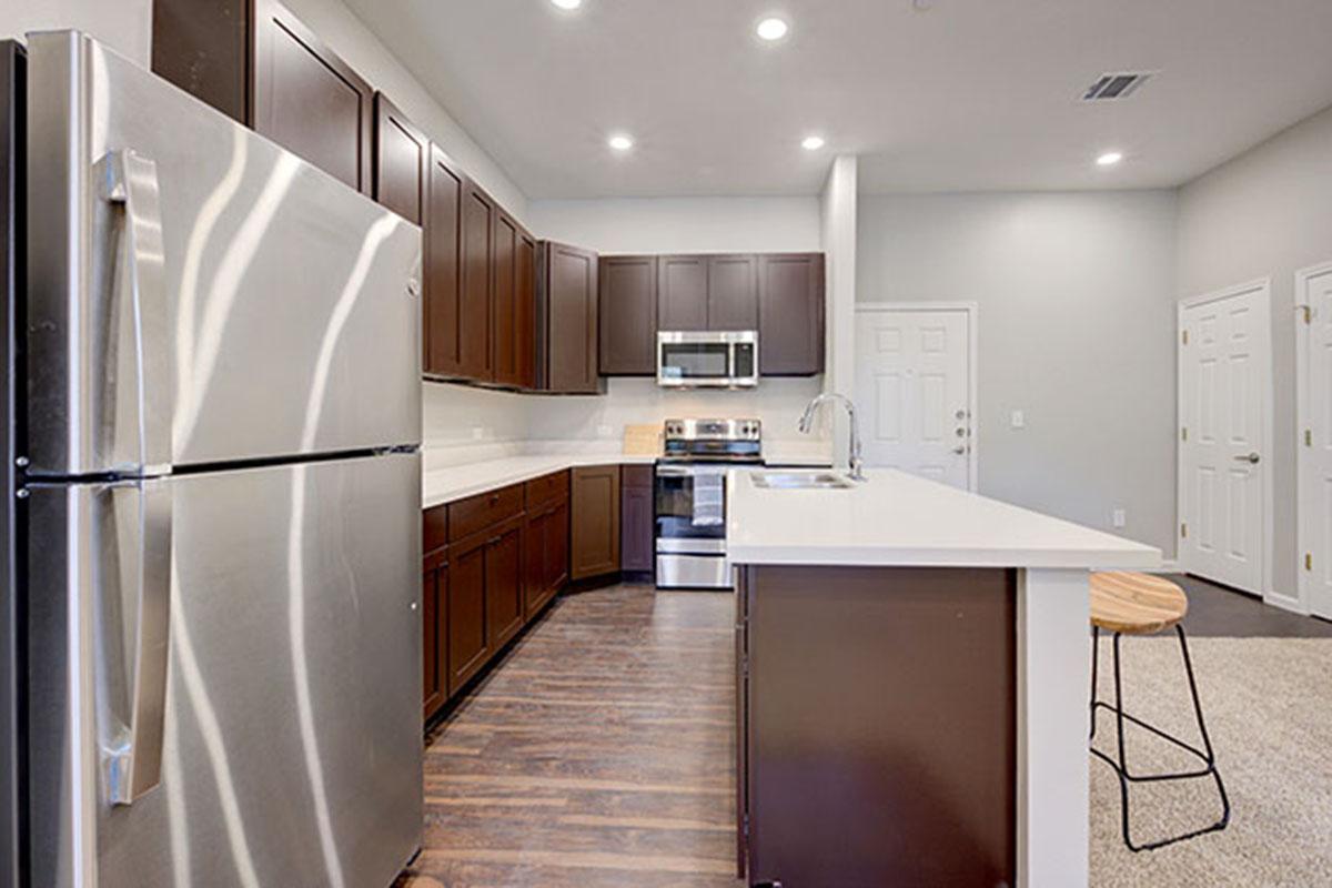 a stainless steel refrigerator in a kitchen