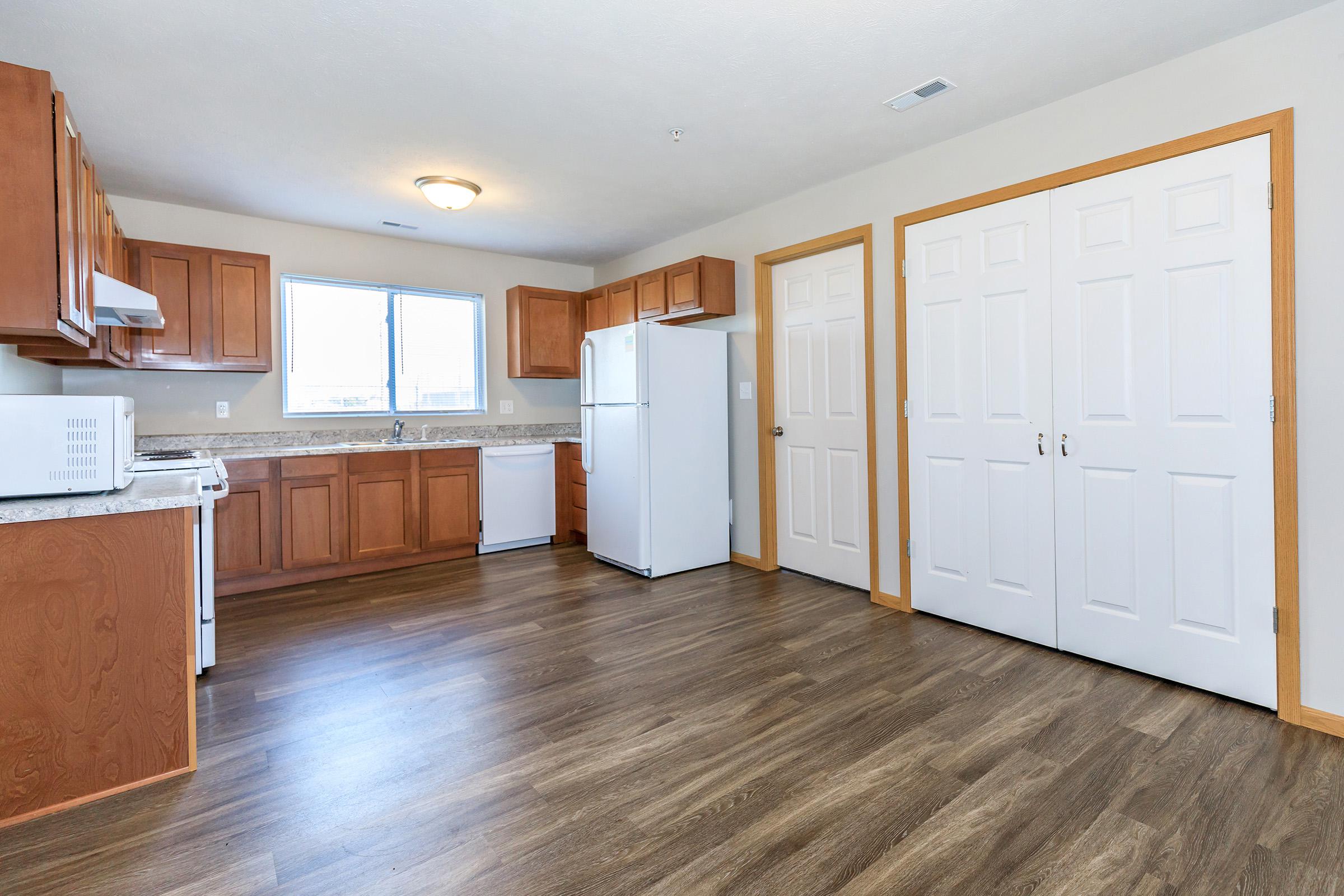 a large empty room with a wooden floor