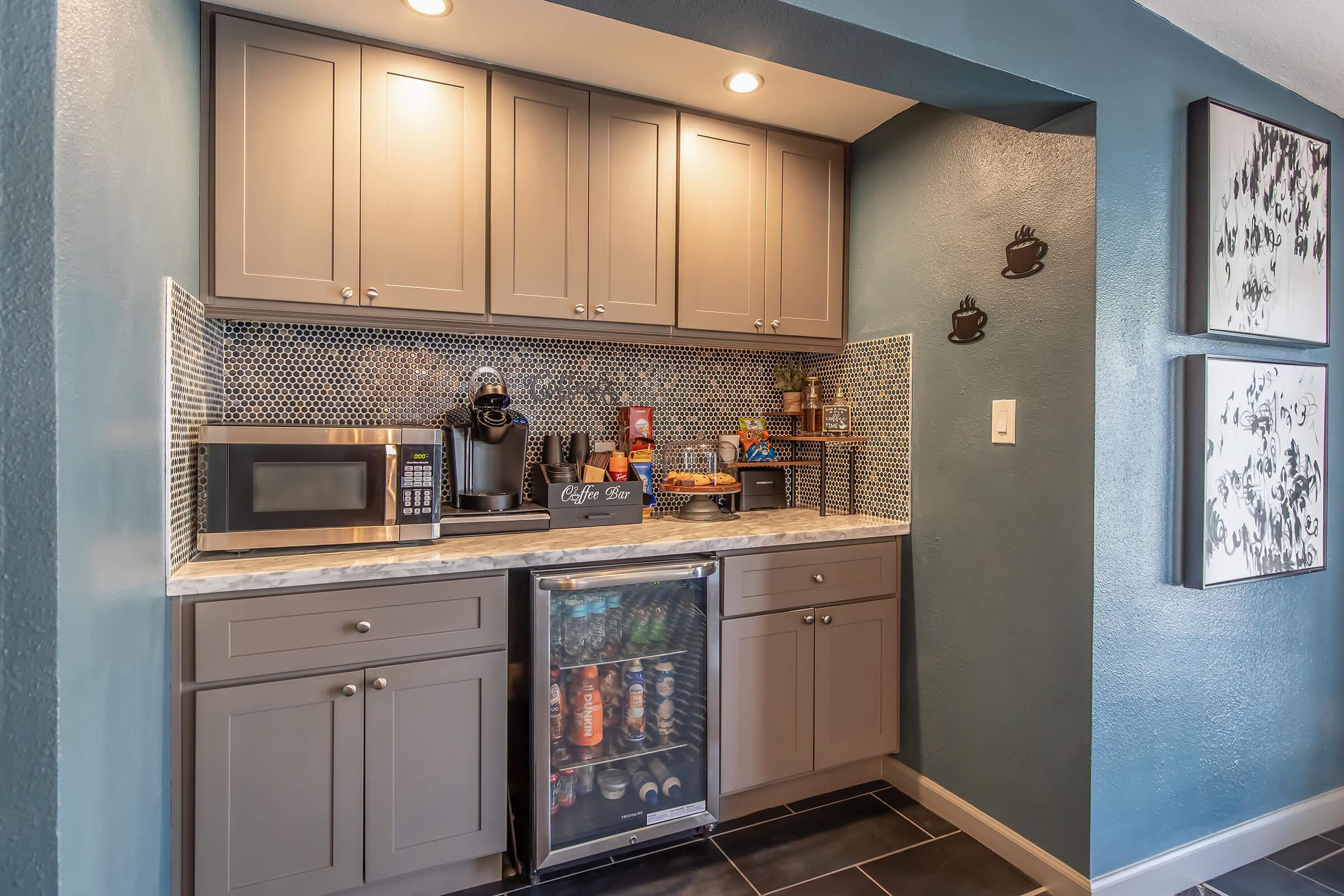 a stove top oven sitting inside of a kitchen