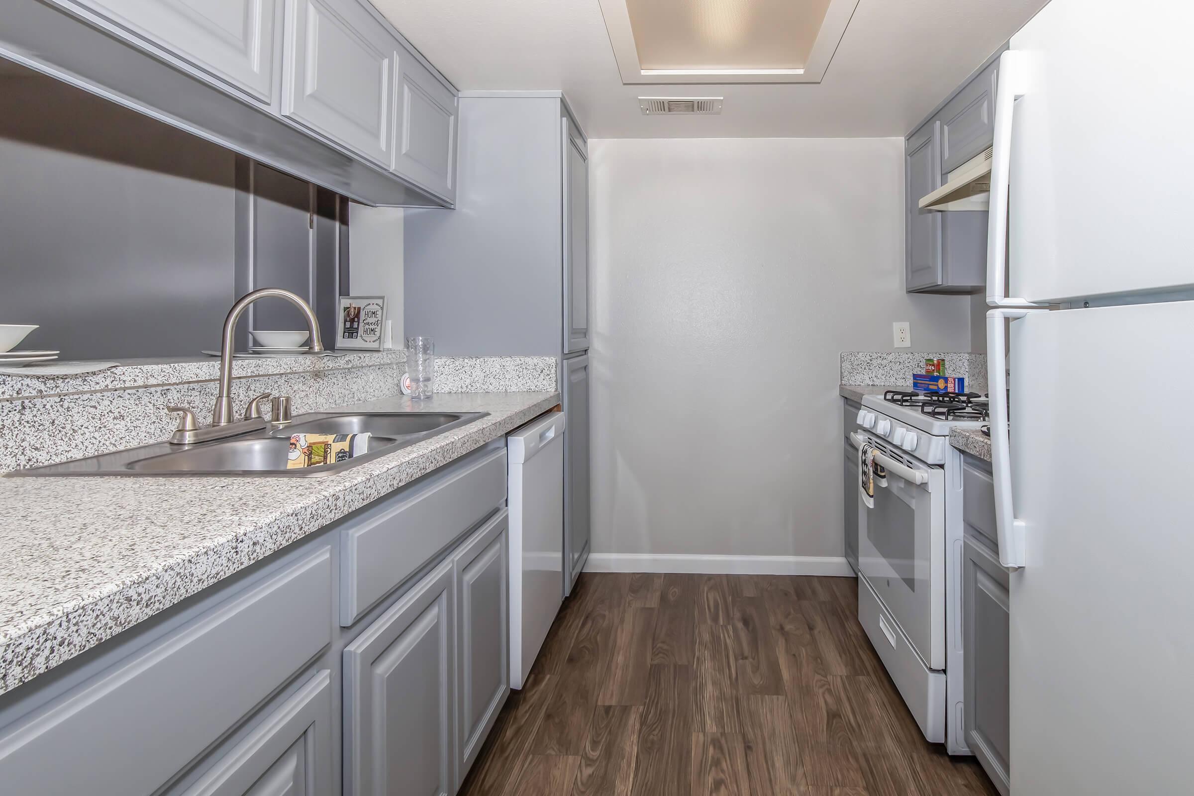 a kitchen with a sink and a window