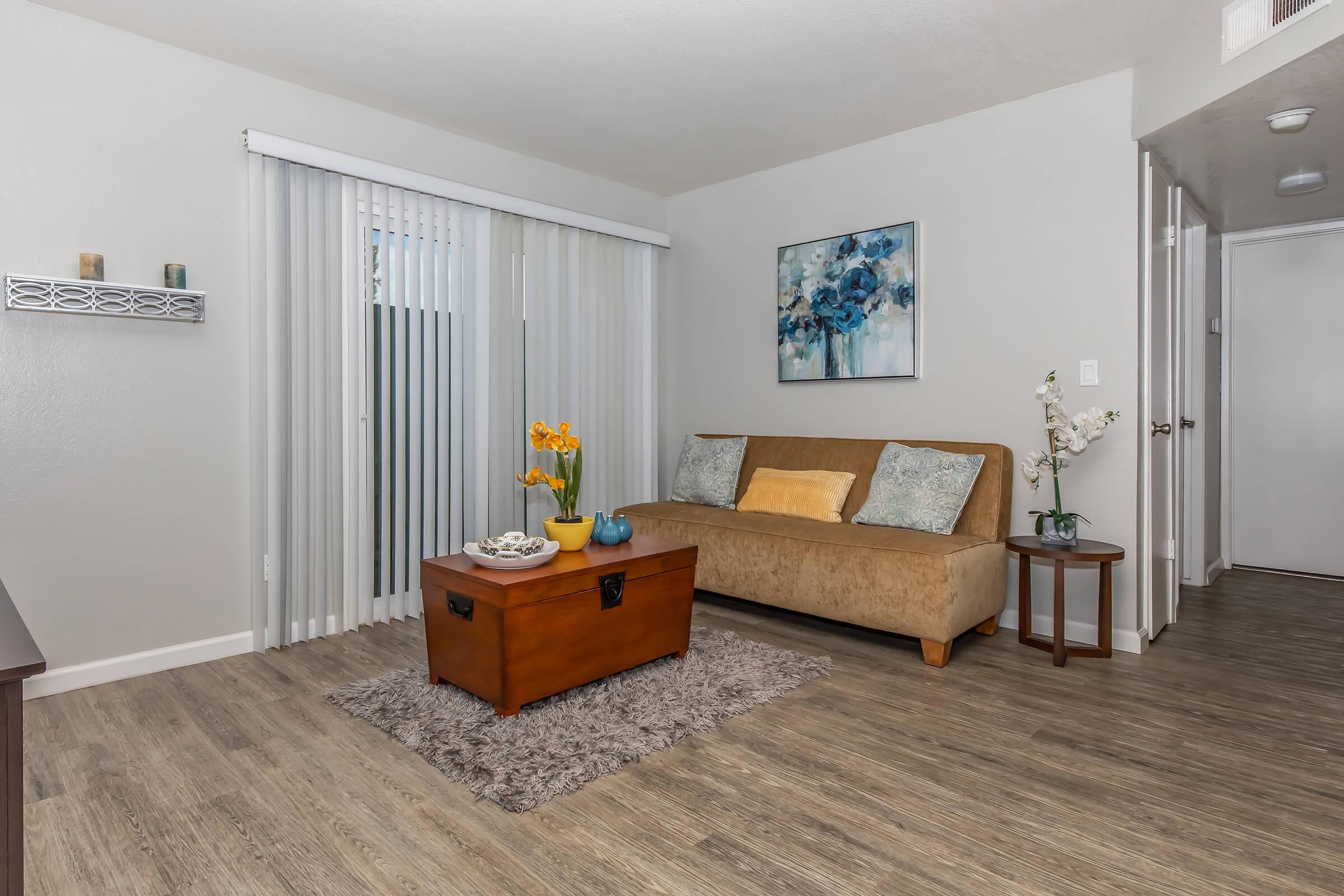 a living room filled with furniture and a tv