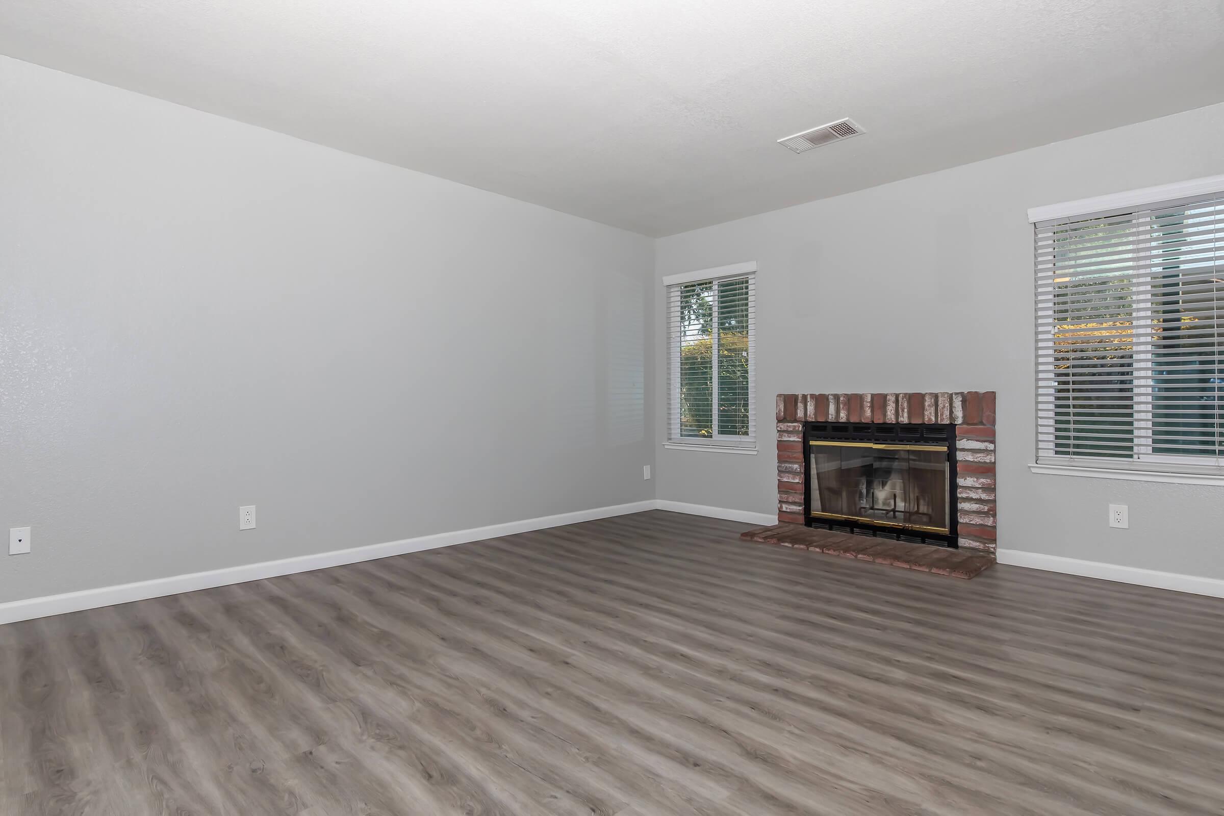 a living room filled with furniture and a flat screen tv