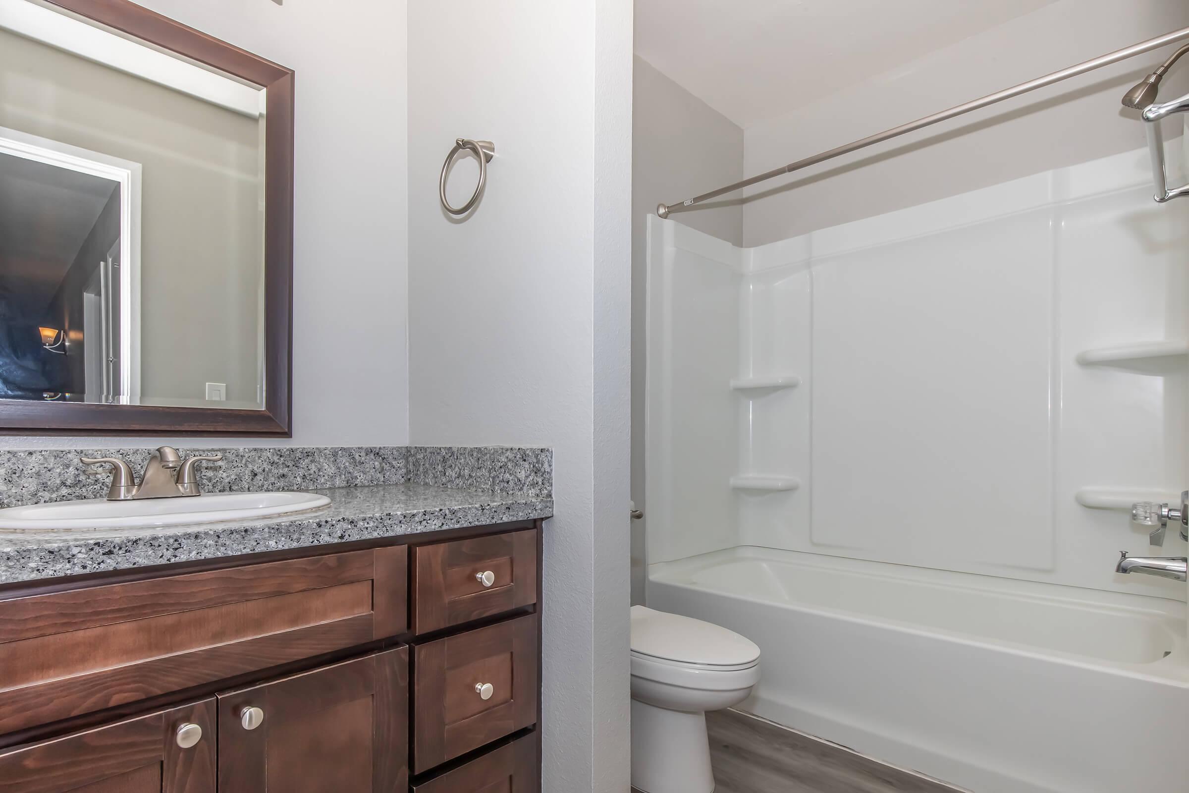 a kitchen with a sink and a mirror