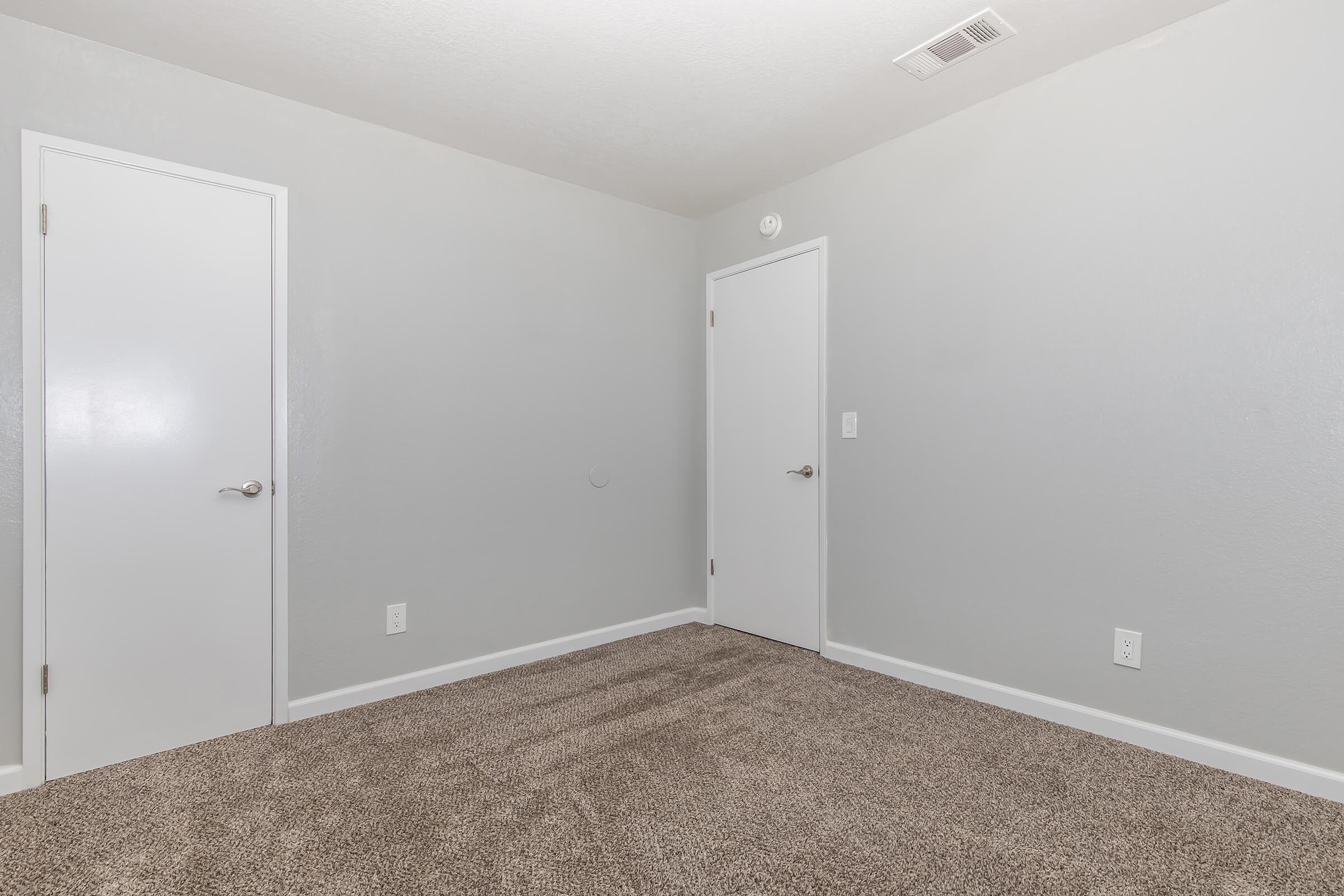 a bedroom with a large mirror