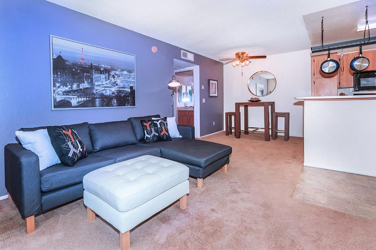 a living room filled with furniture and a flat screen tv