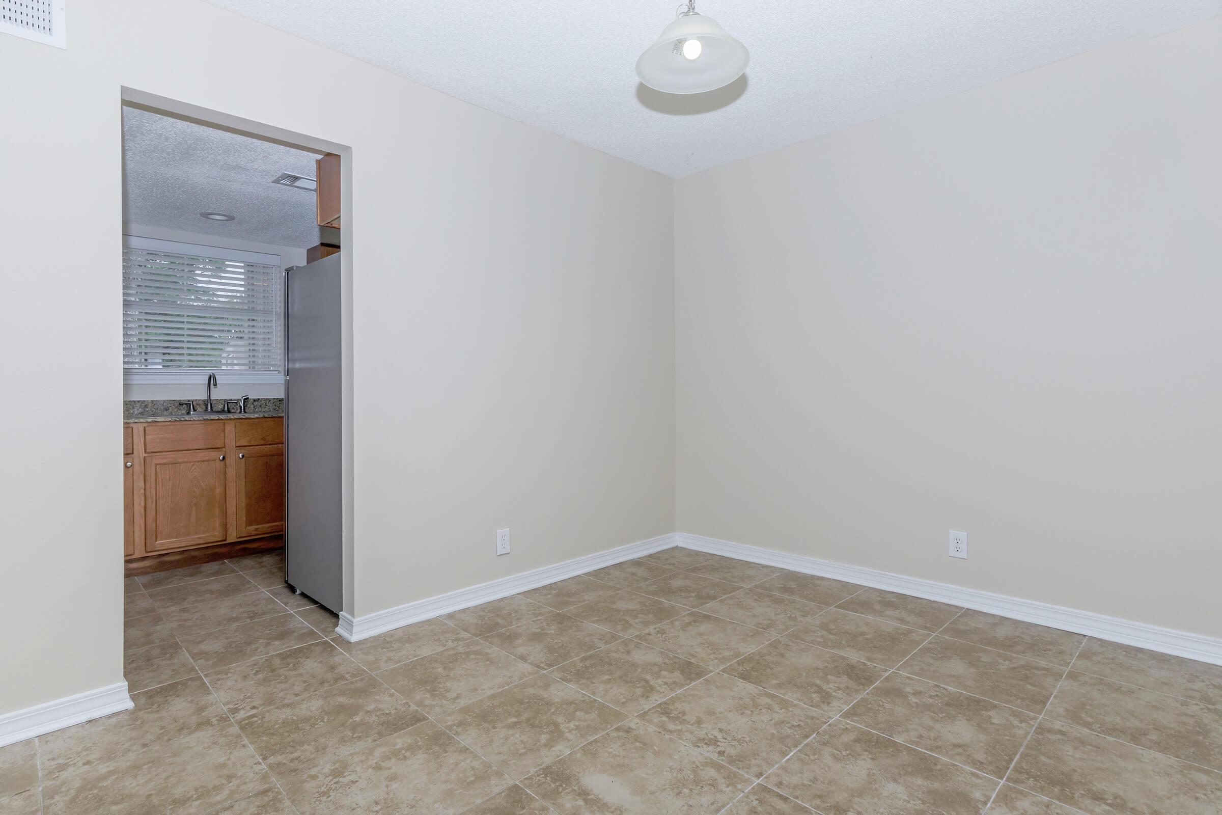 a kitchen with a sink and a refrigerator