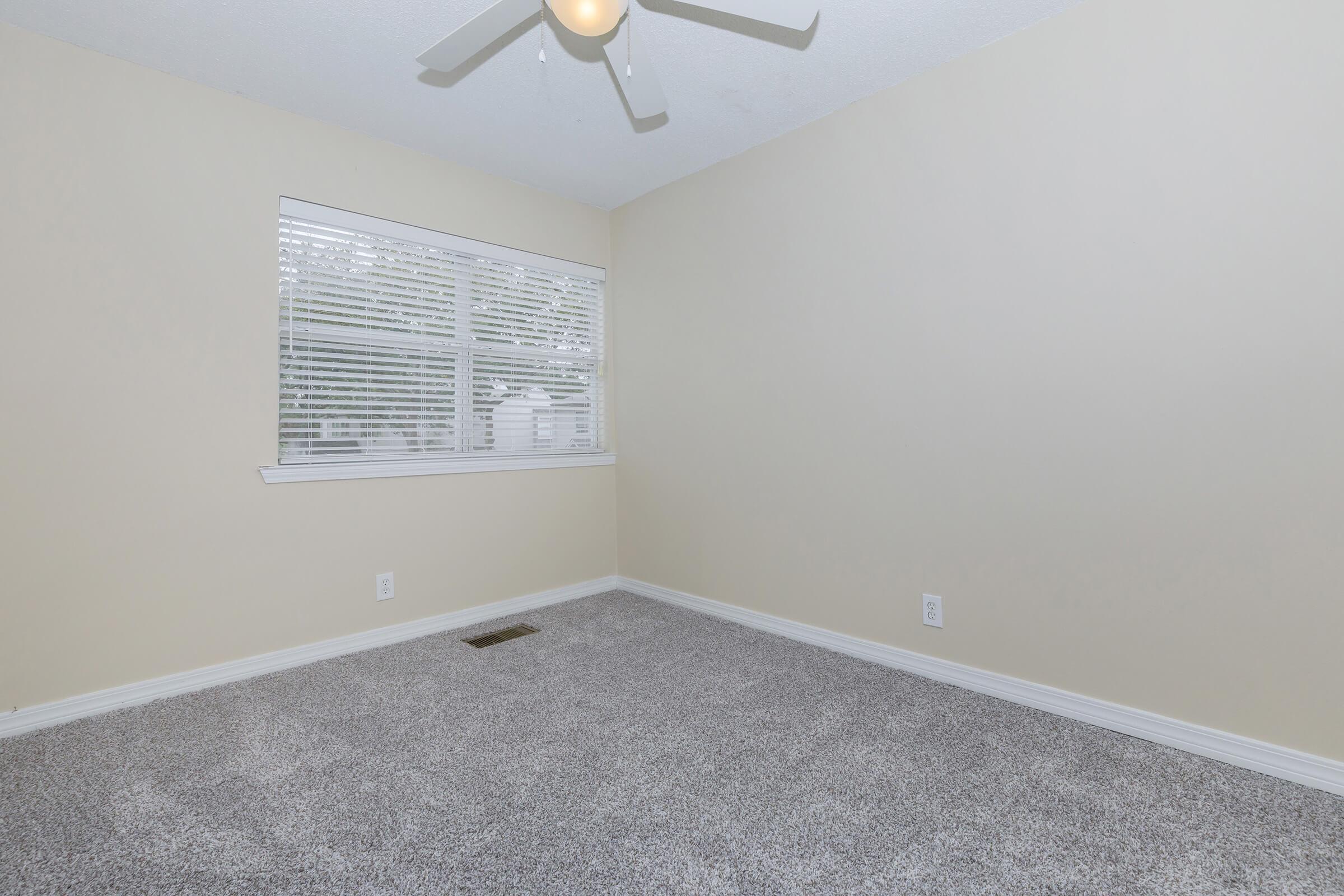 a bedroom with a large mirror