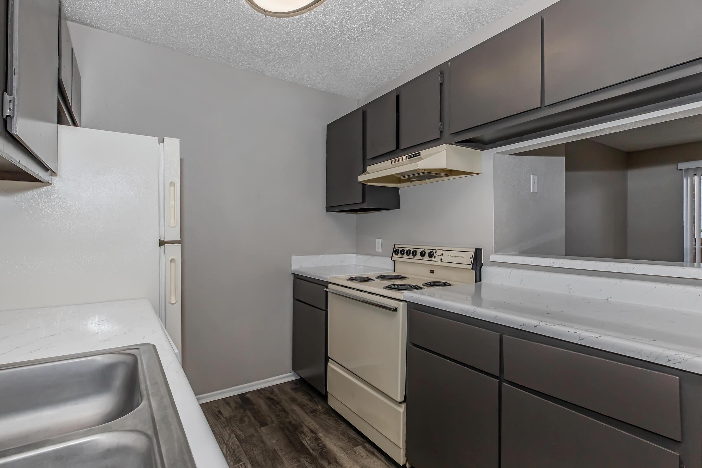 a kitchen with a stove and a sink