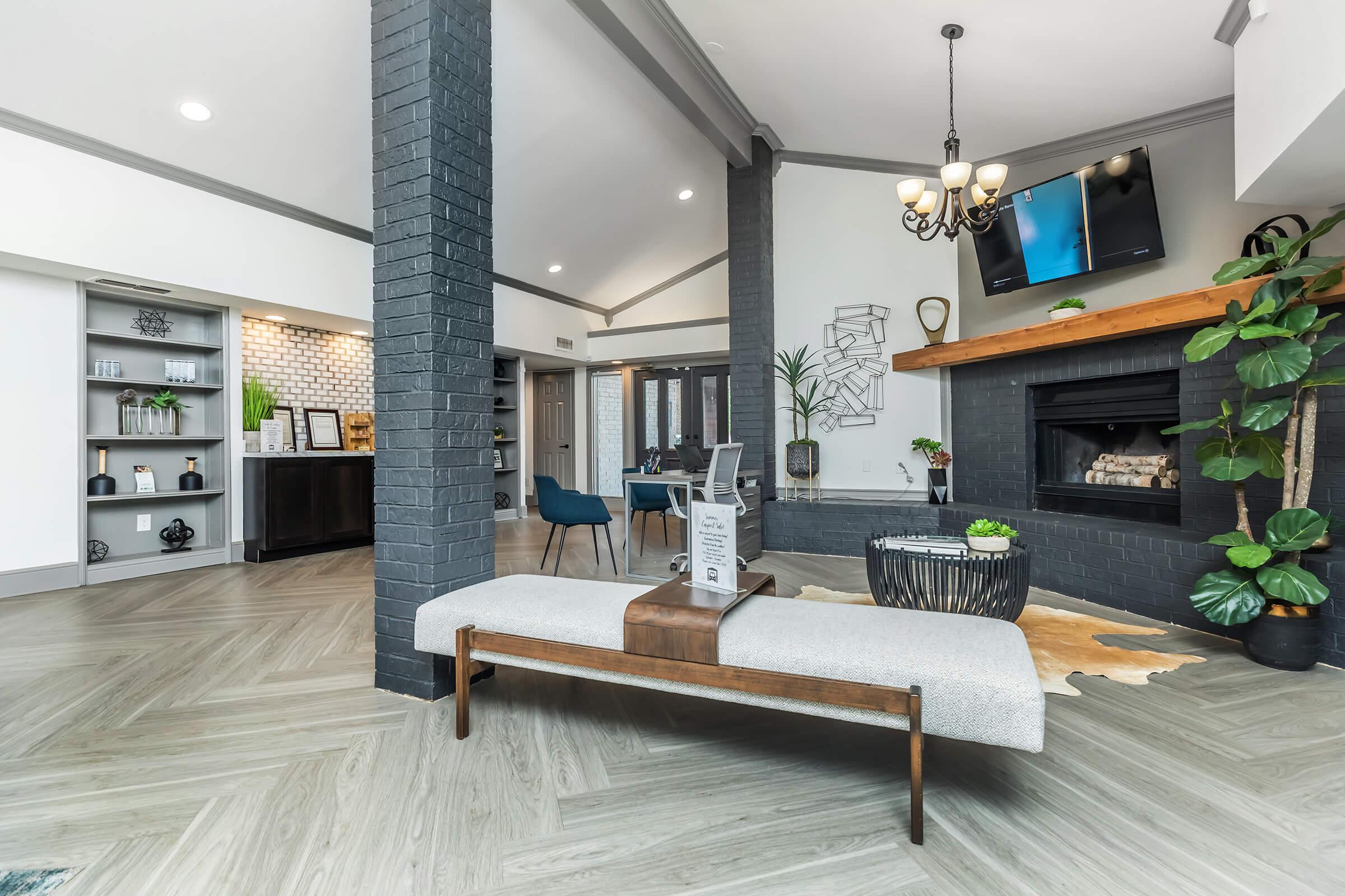 a living room filled with furniture and a fireplace