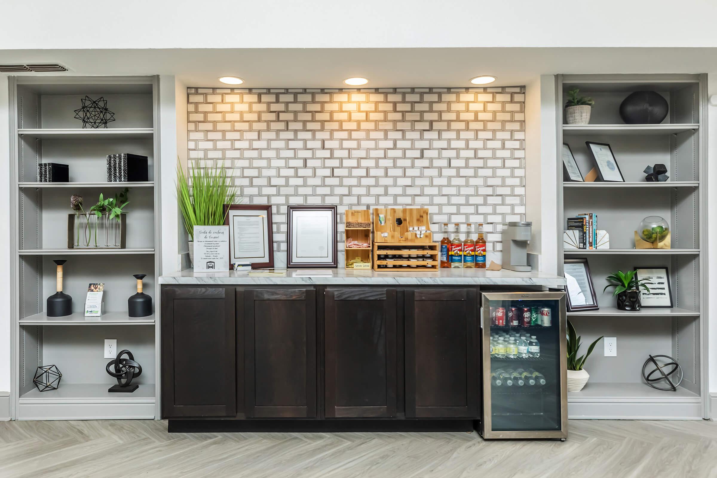 a kitchen with a book shelf