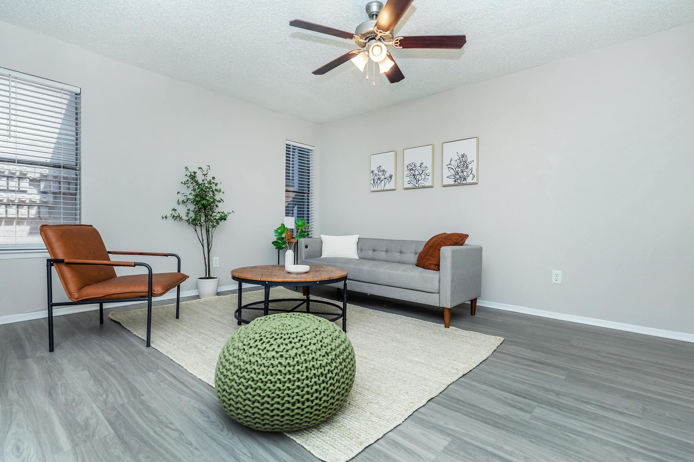 a living room filled with furniture and a clock