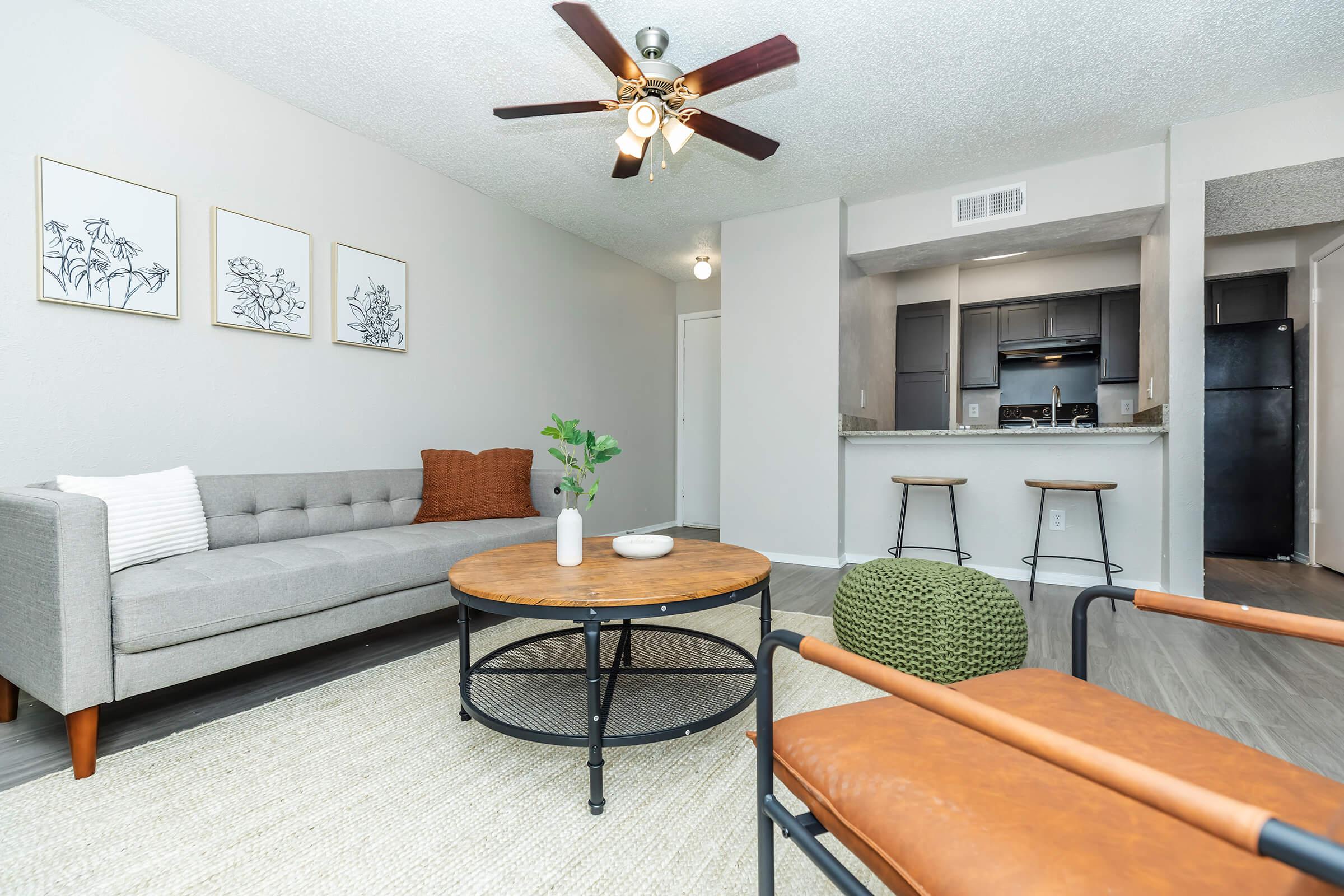 a bedroom with a bed and a chair in a room