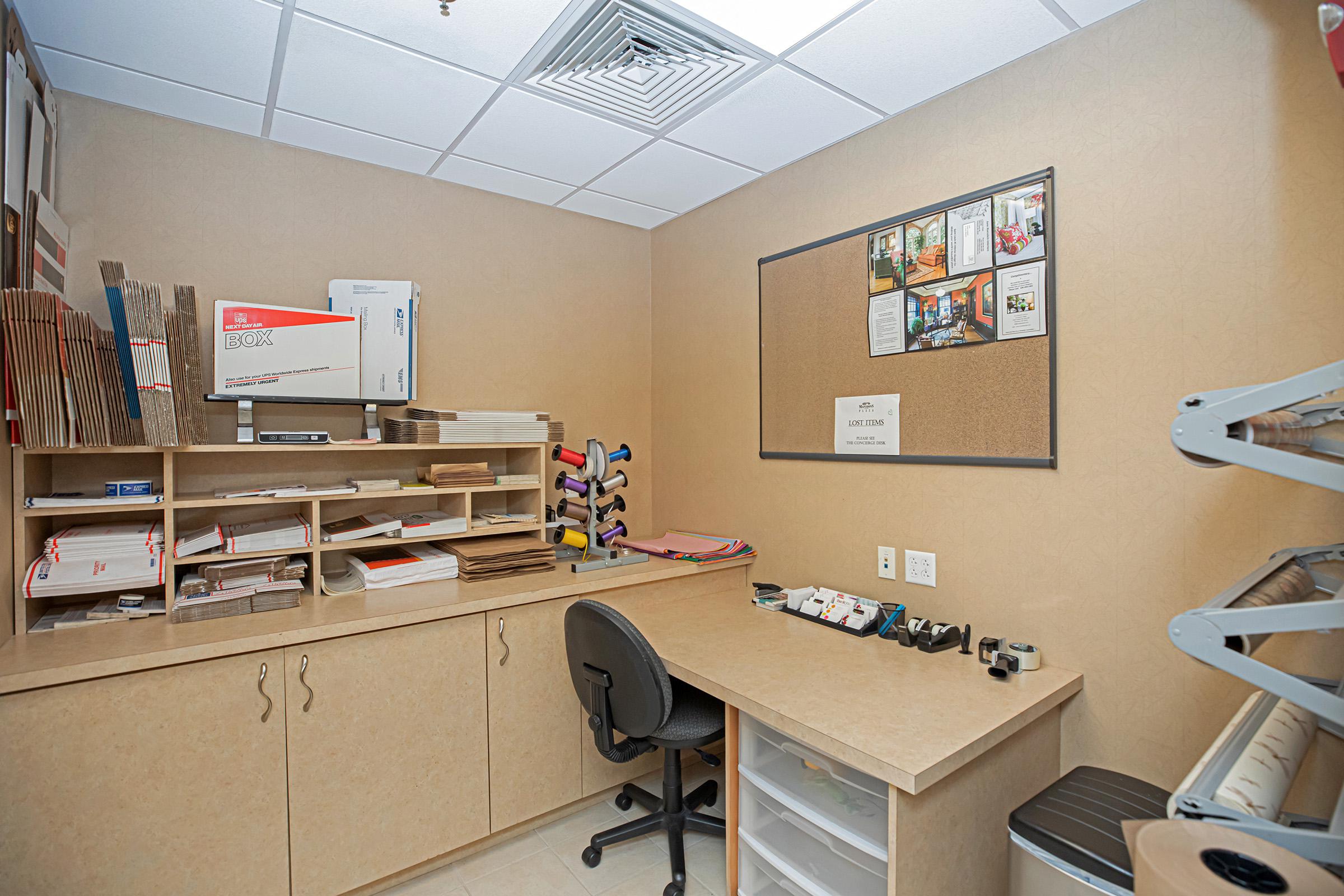 a desk with a computer in a room