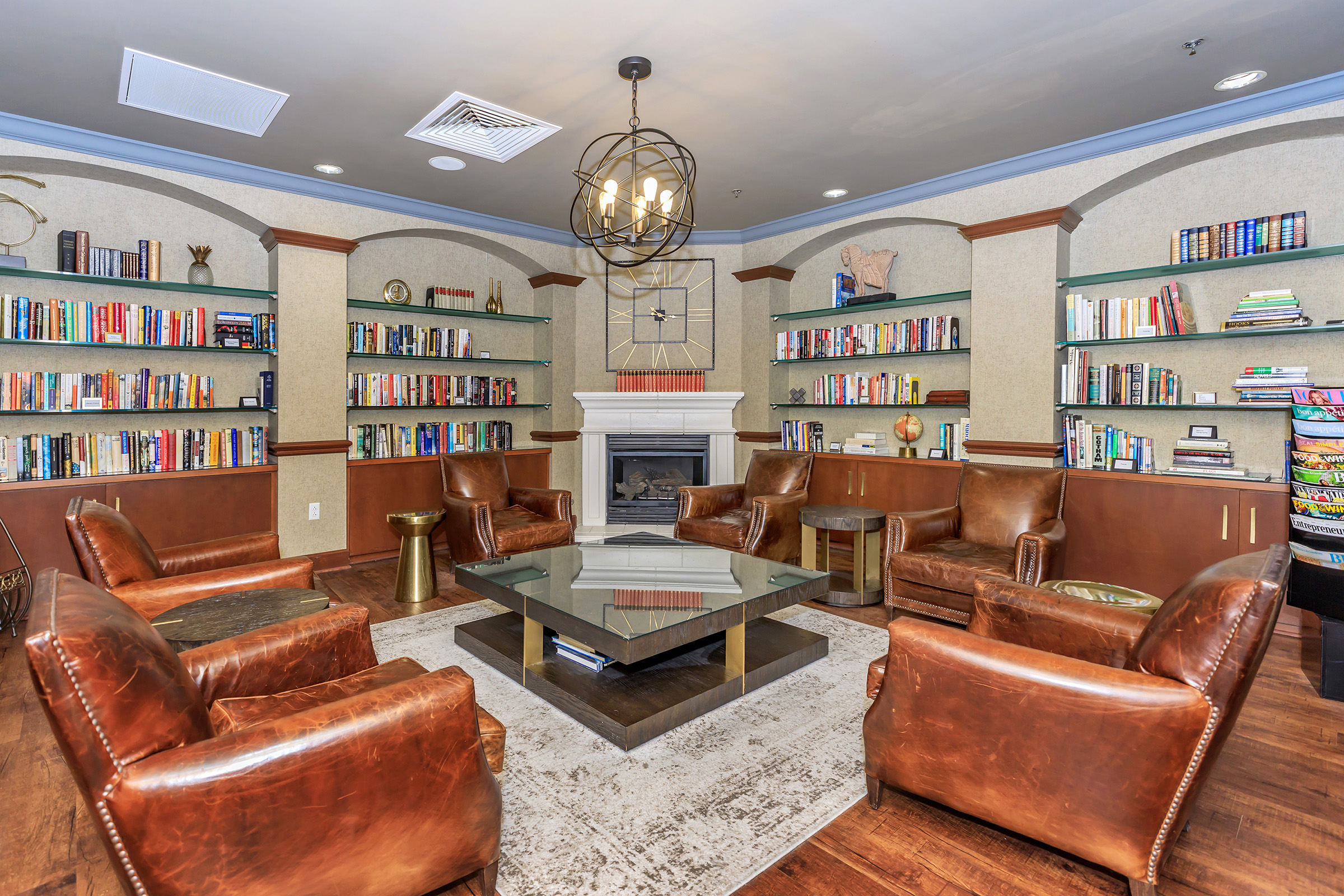 a living room filled with furniture and a fireplace