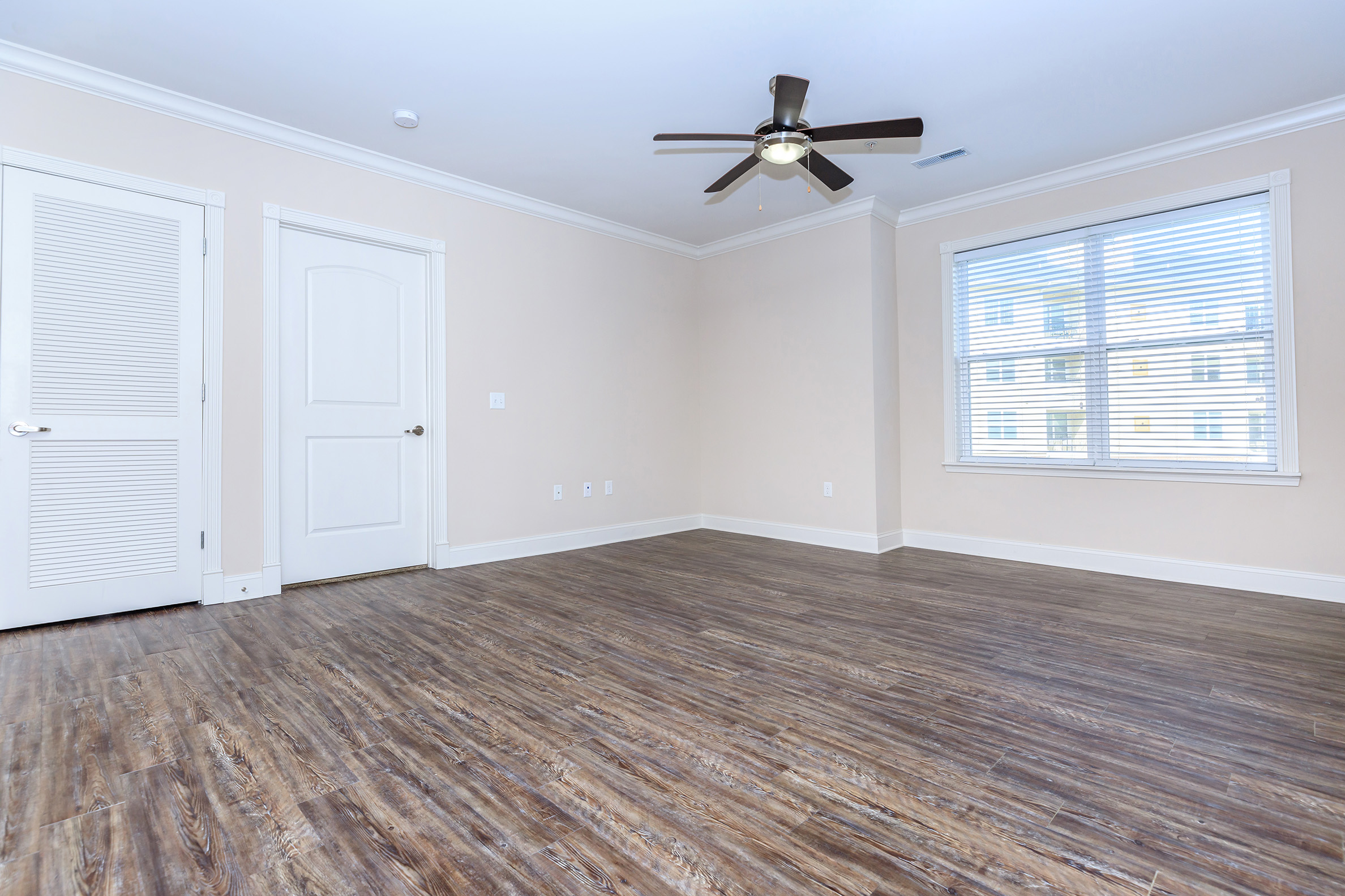 a bedroom with a large window