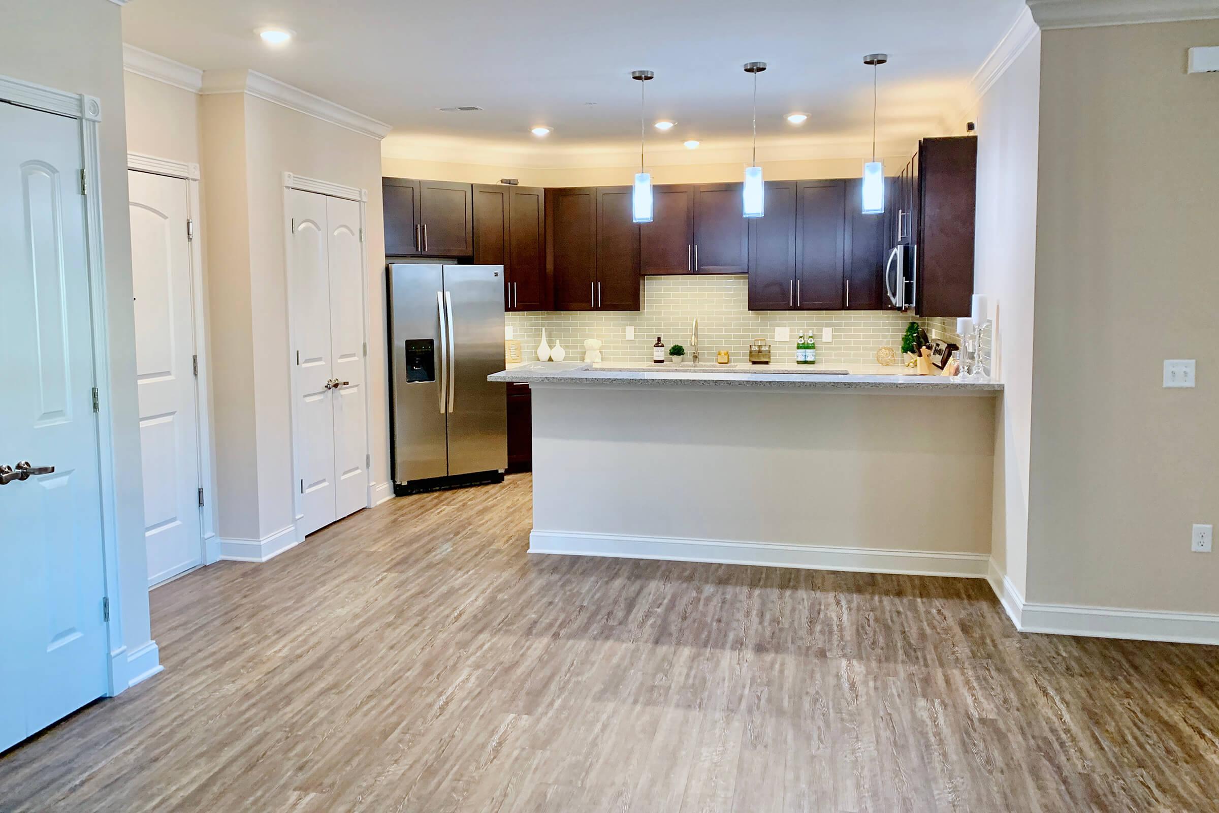 a kitchen with a wood floor