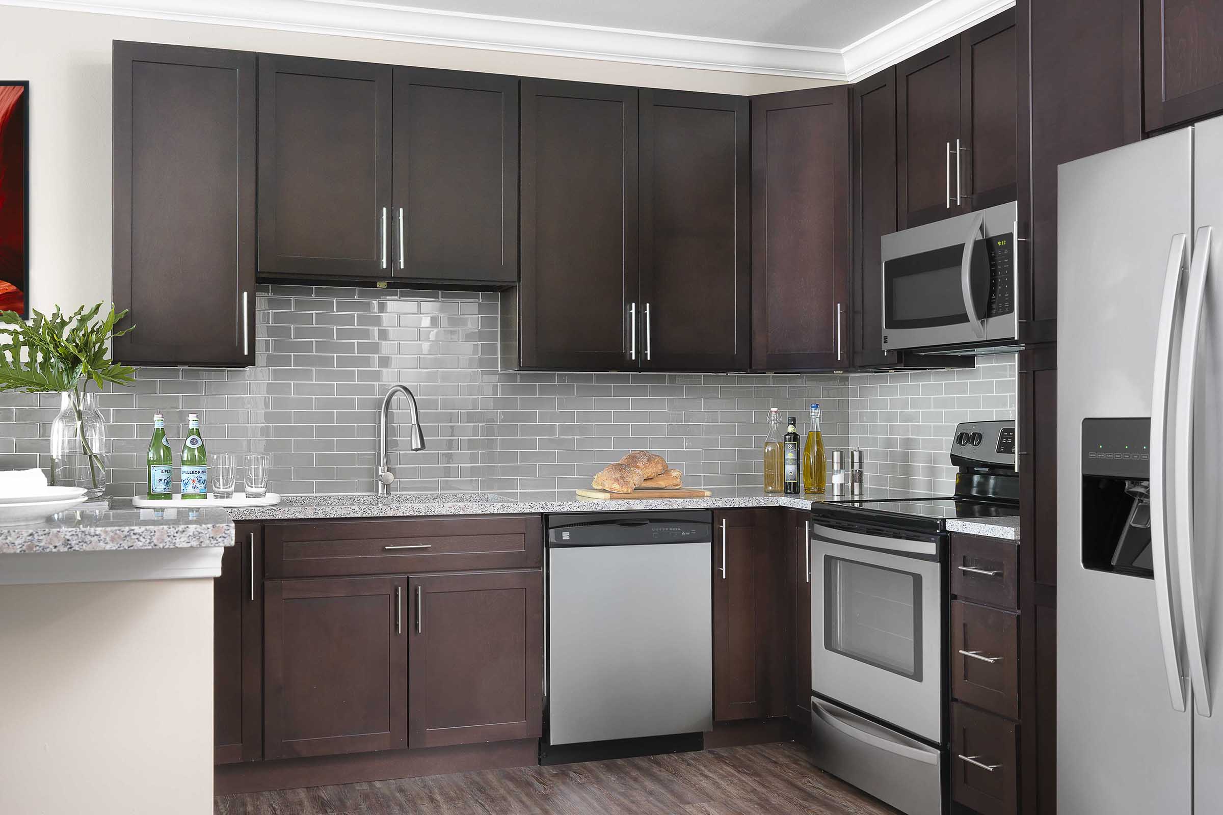 a large kitchen with stainless steel appliances