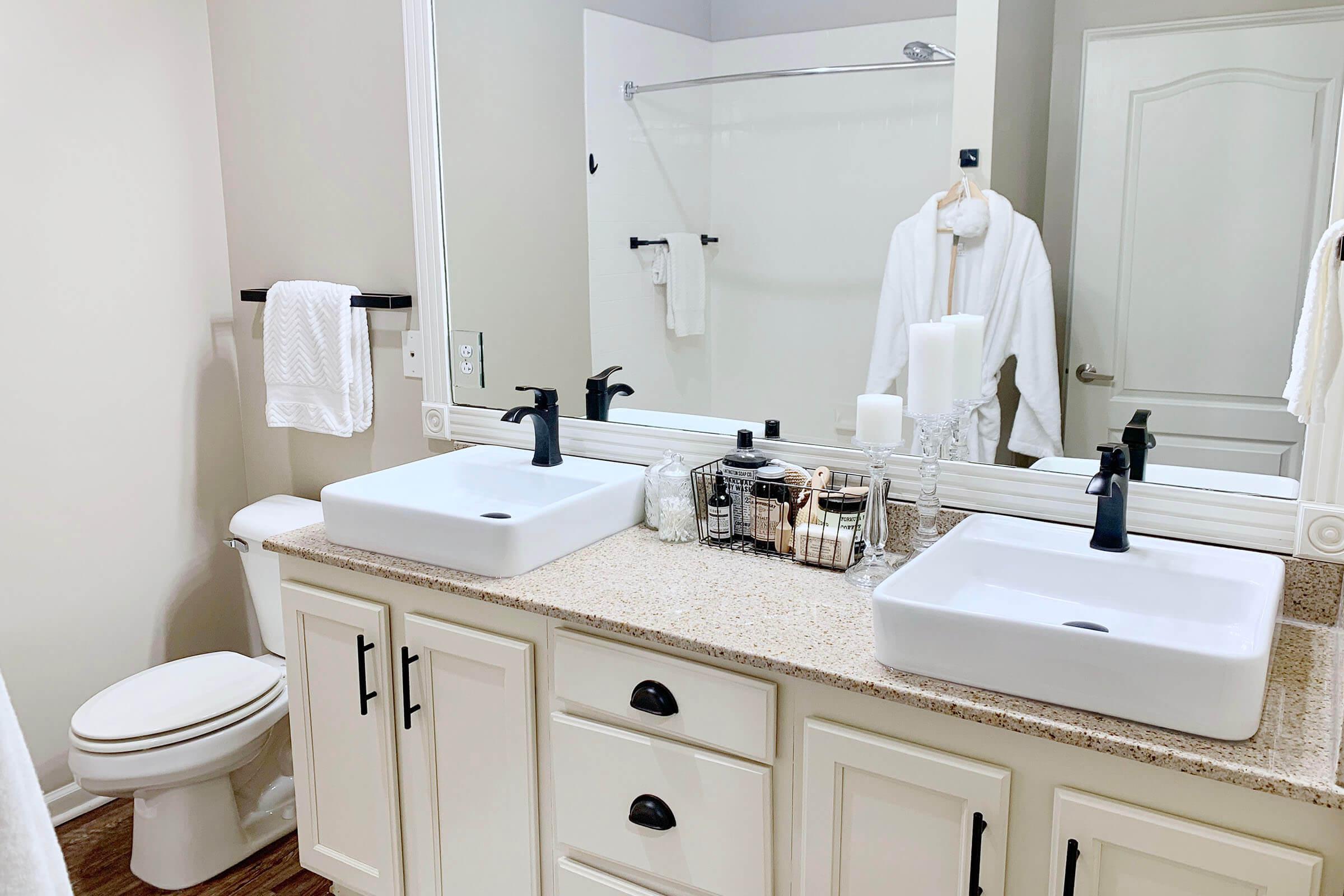 a kitchen with a sink and a mirror