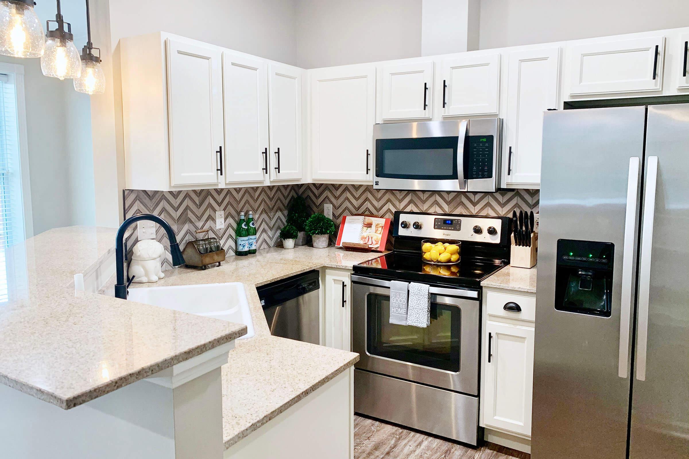 a kitchen with a sink and a microwave