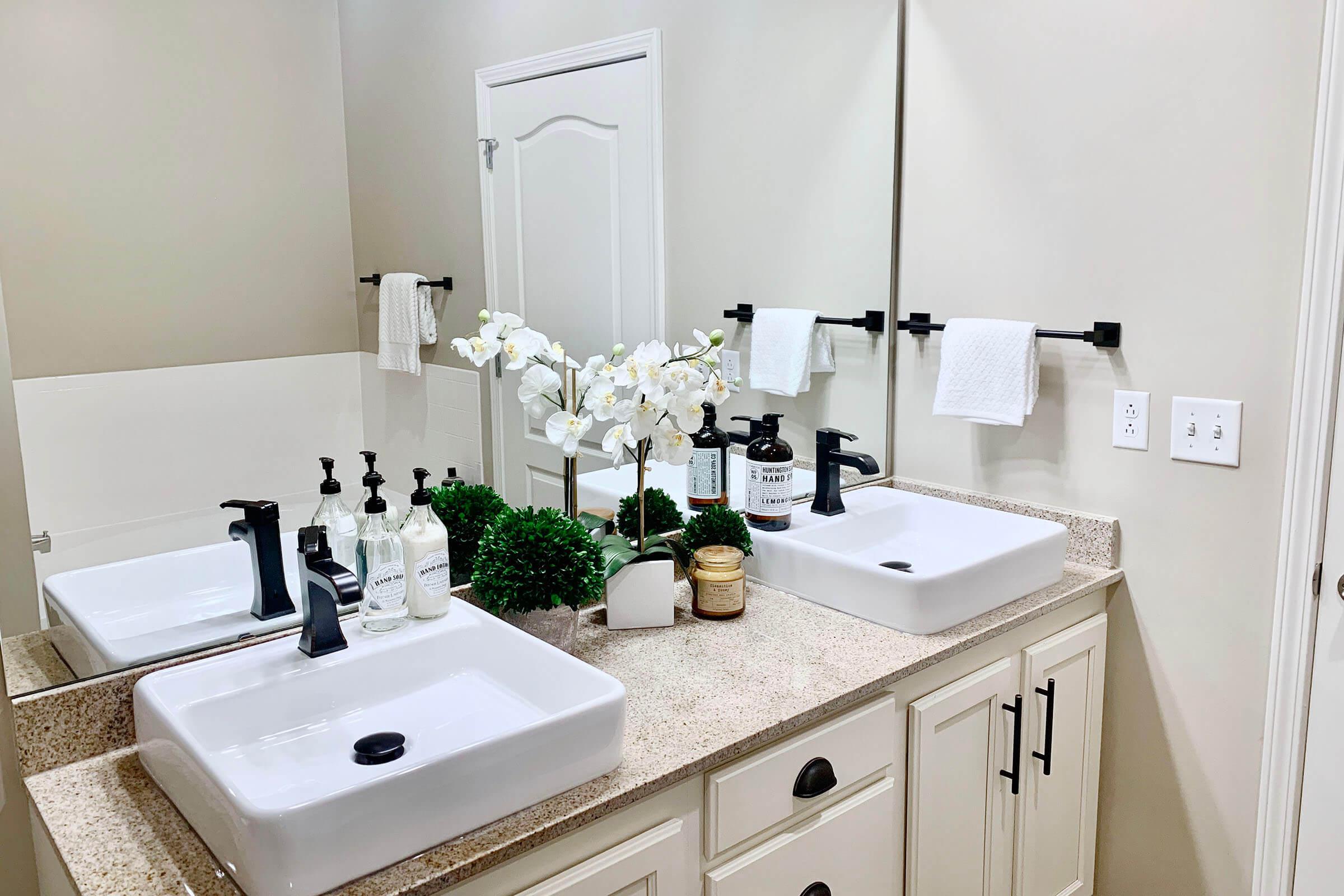 a kitchen with a sink and a mirror