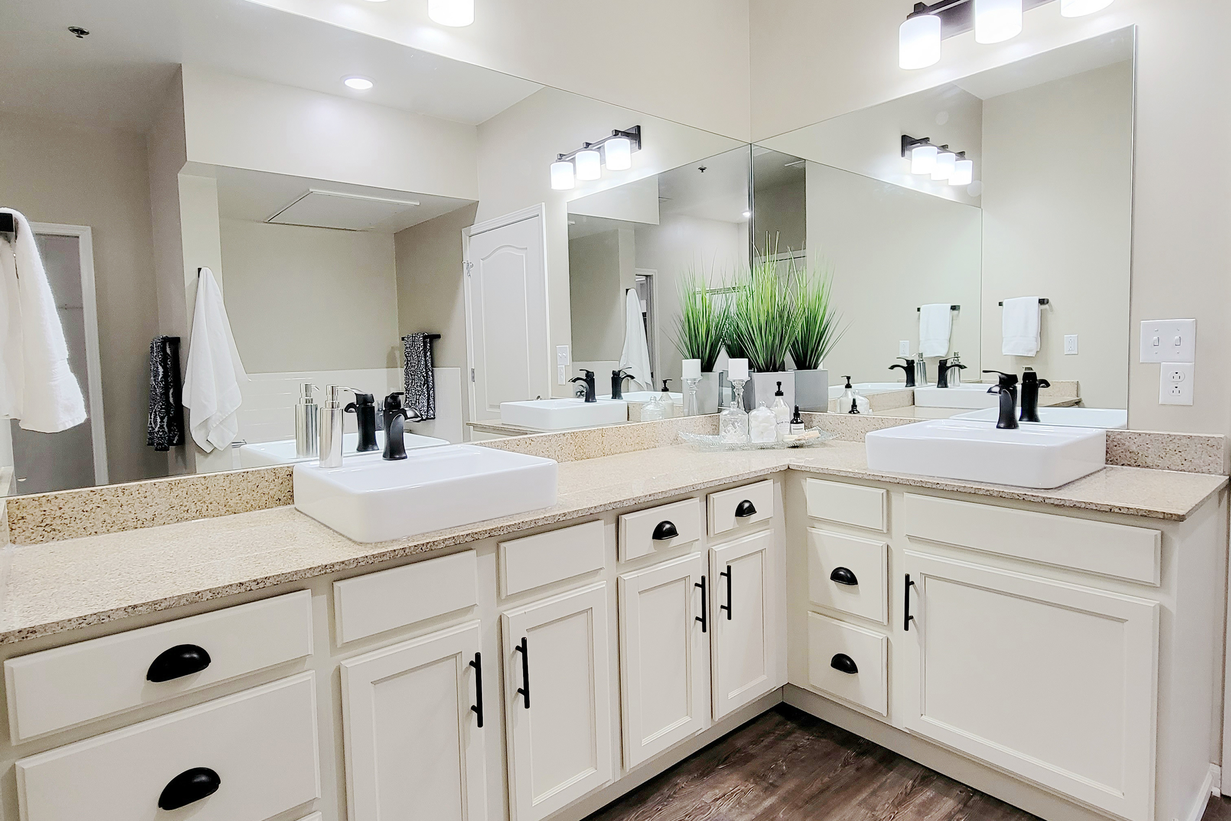 a kitchen with a sink and a mirror