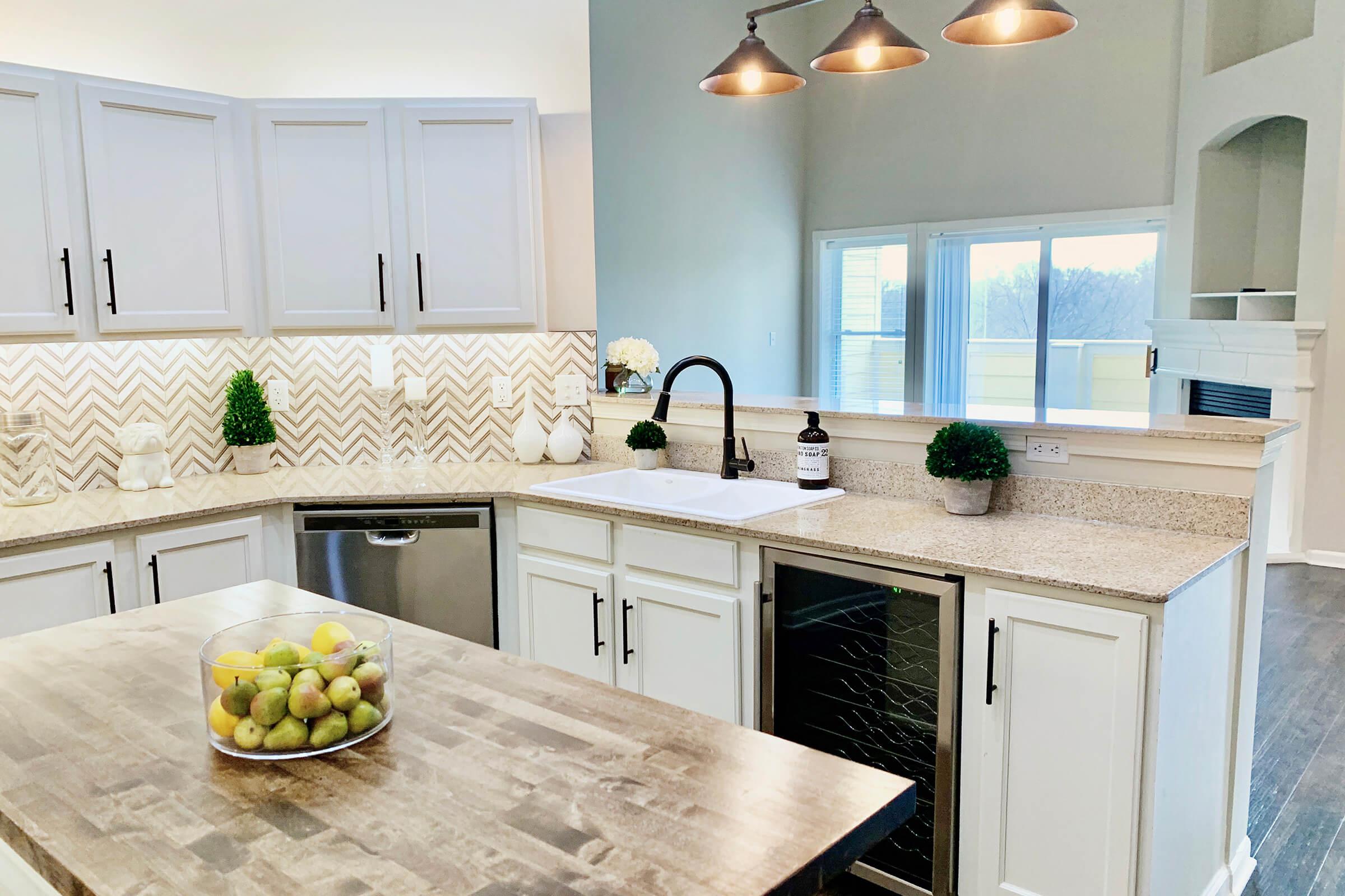 a kitchen with a sink and a window