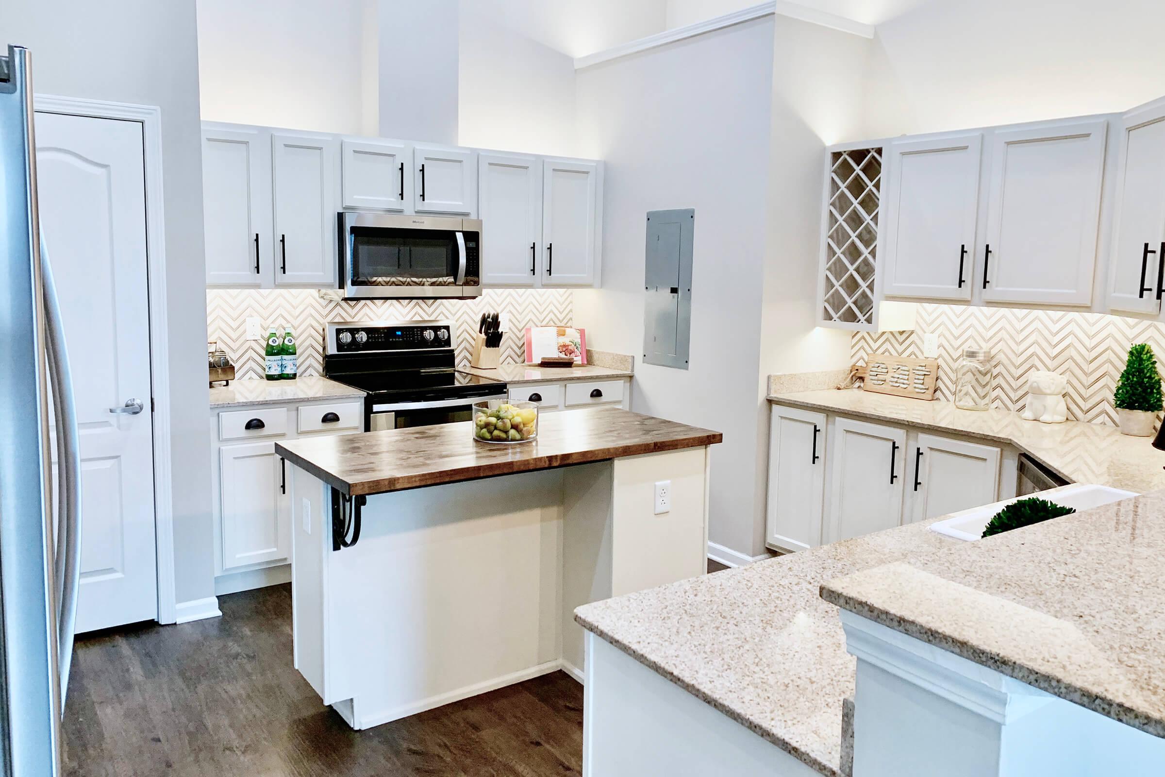 a kitchen with a sink and a refrigerator