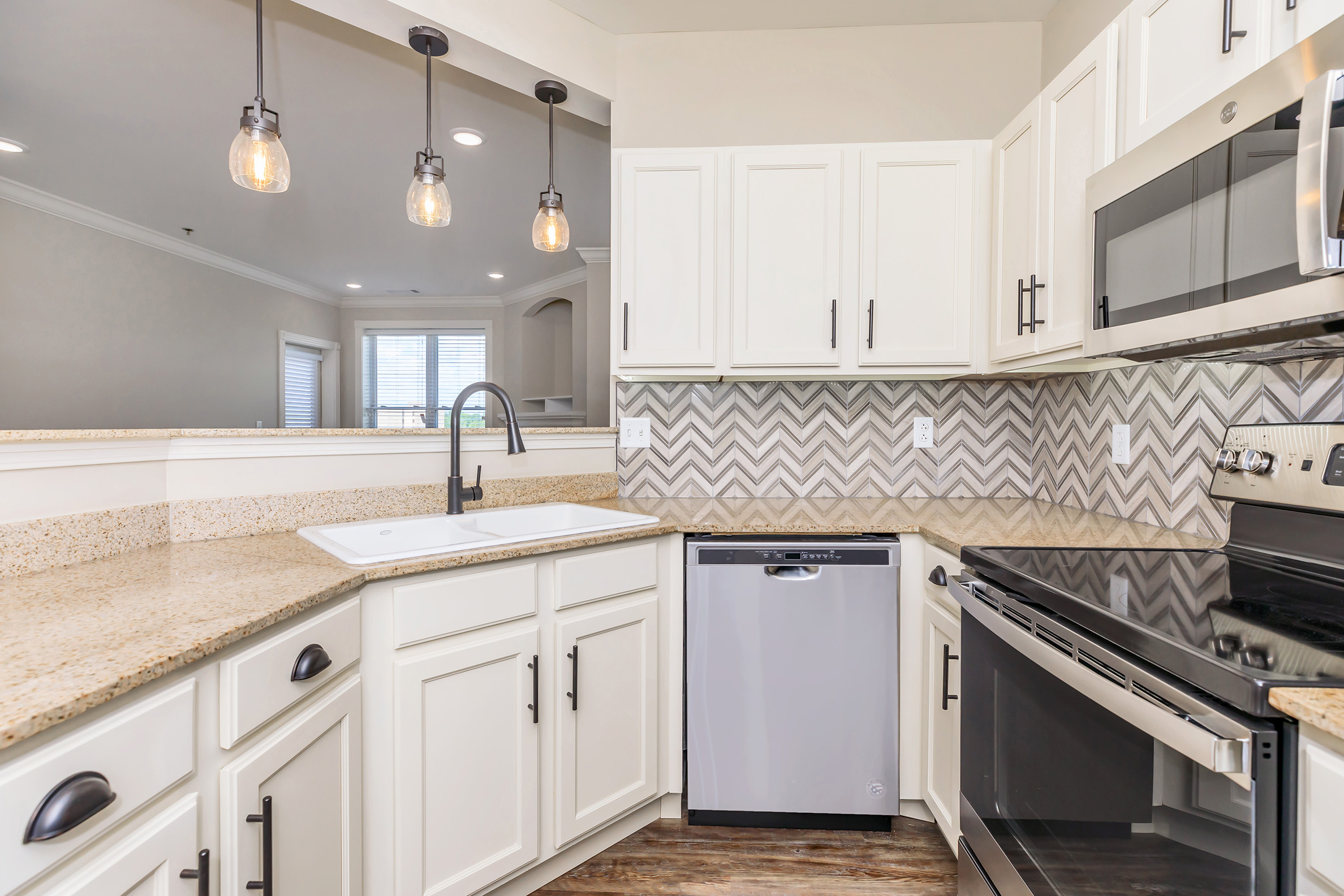 a kitchen with a stove and a sink