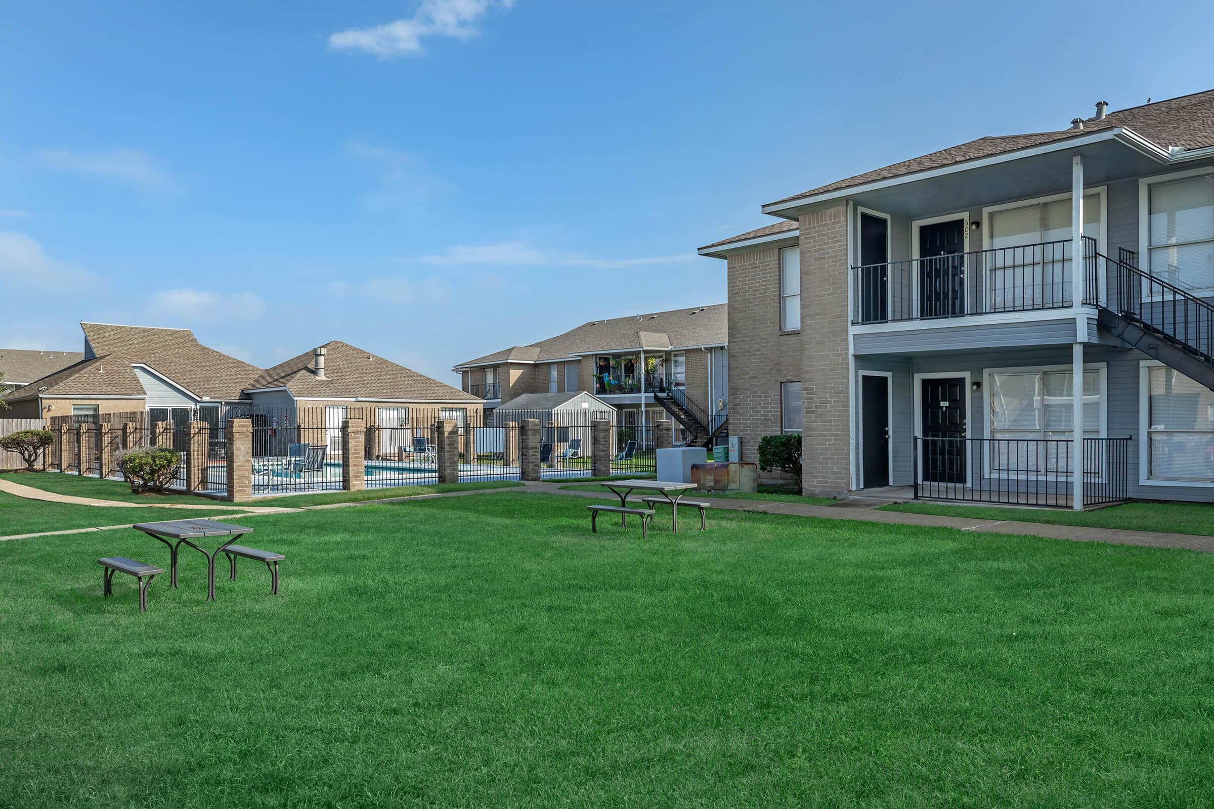 a large lawn in front of a house