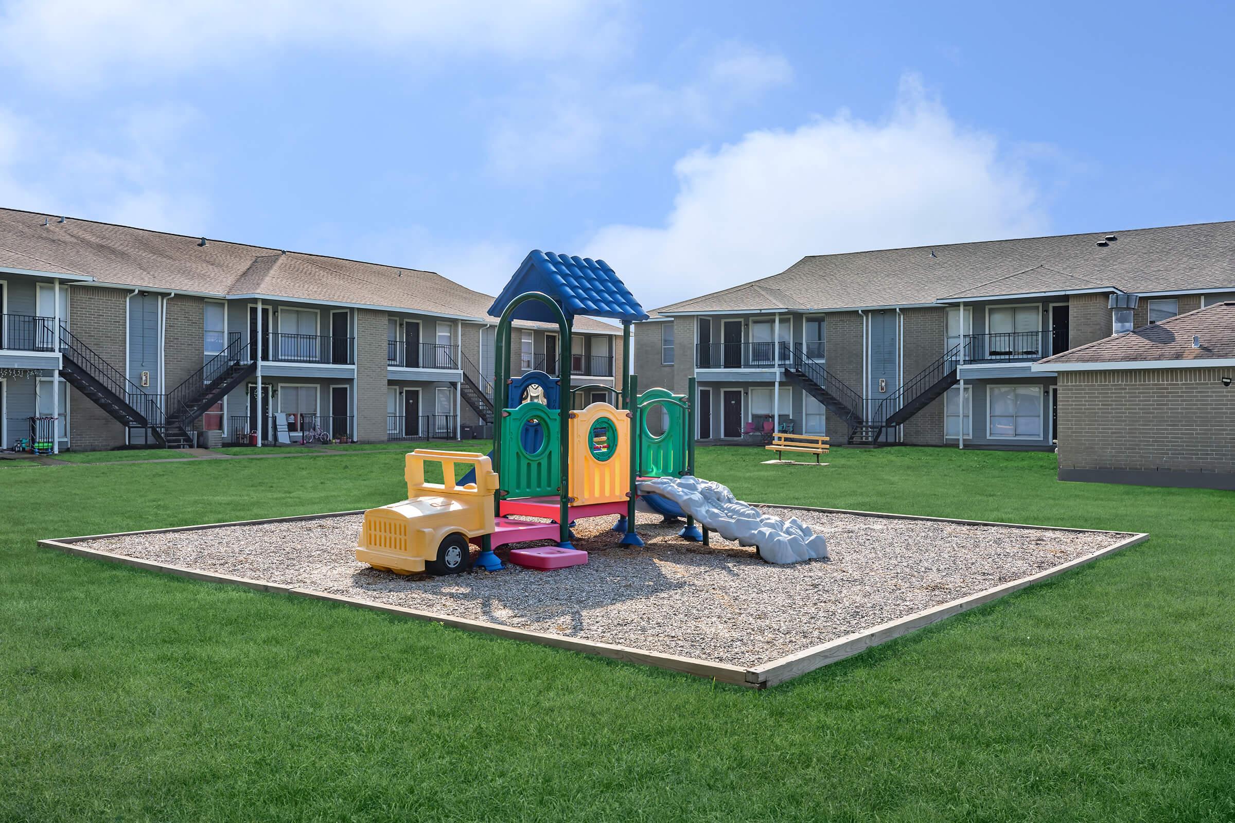 a toy train in front of a house