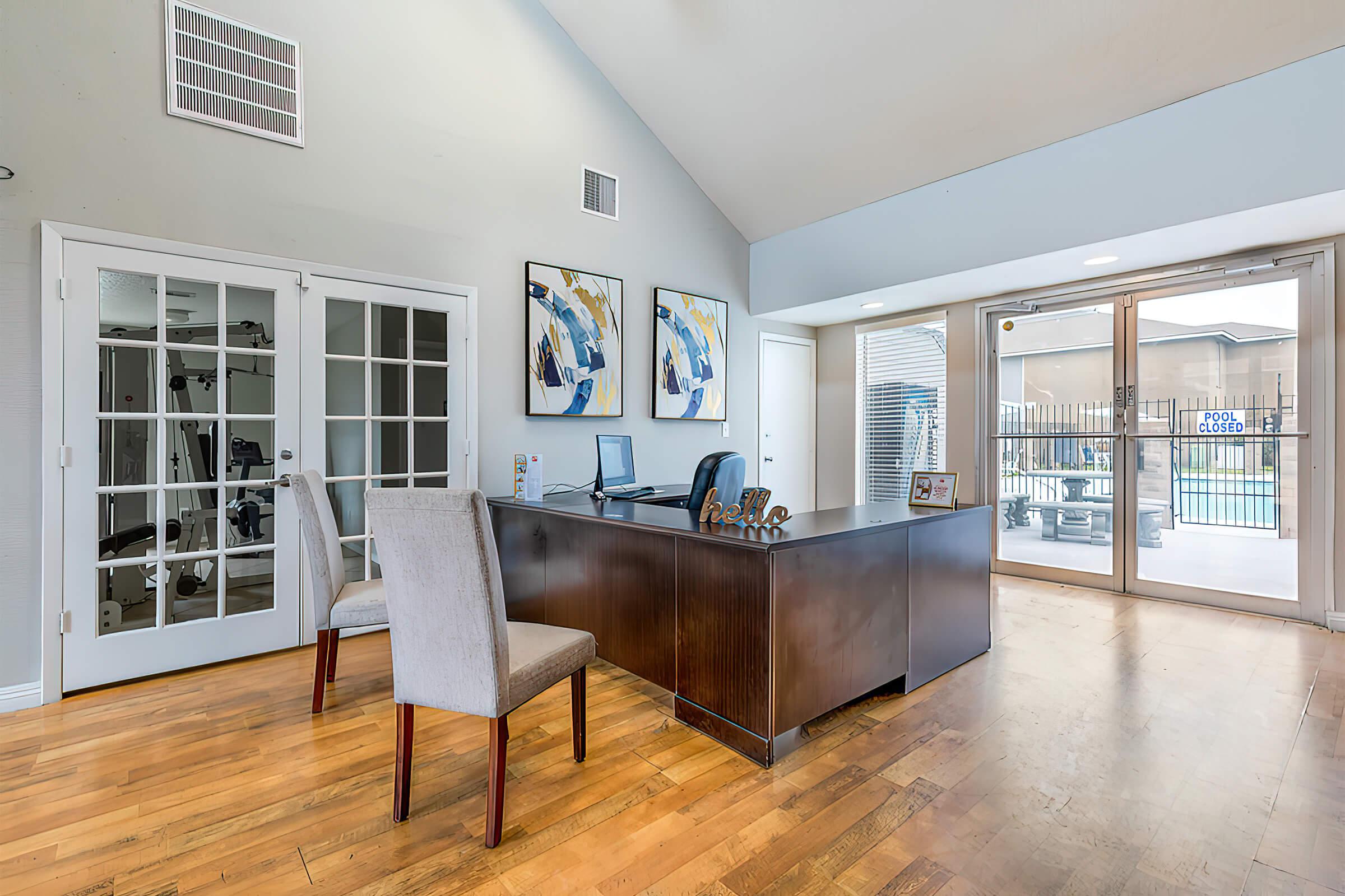 a living room filled with furniture and a large window