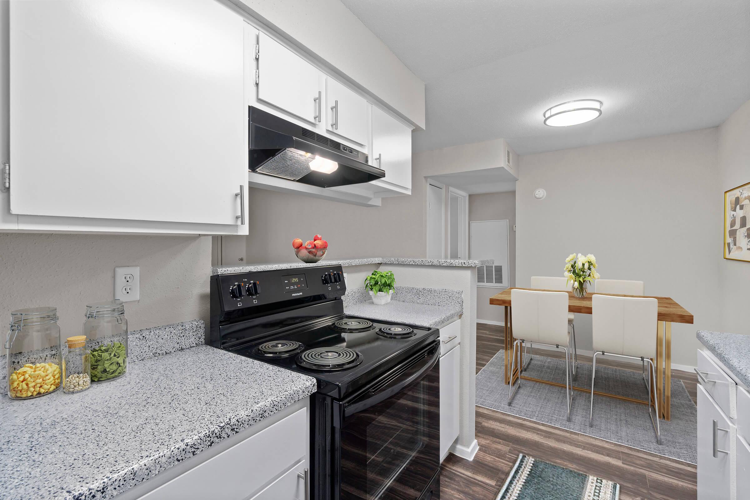 a kitchen with a stove sink and refrigerator