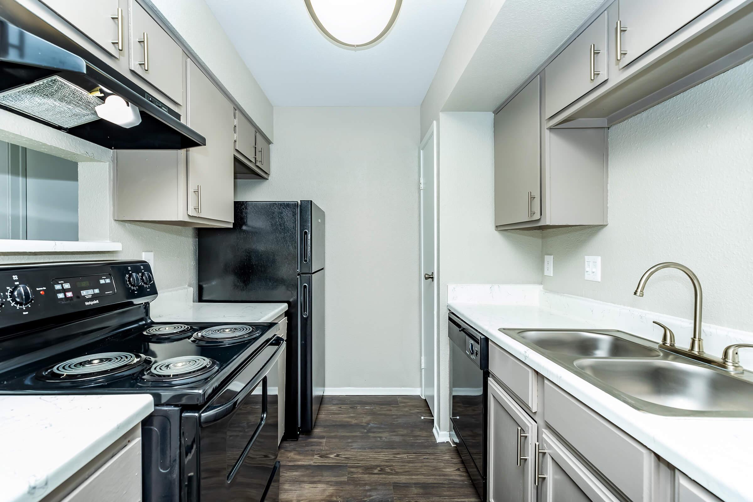 a large kitchen with stainless steel appliances